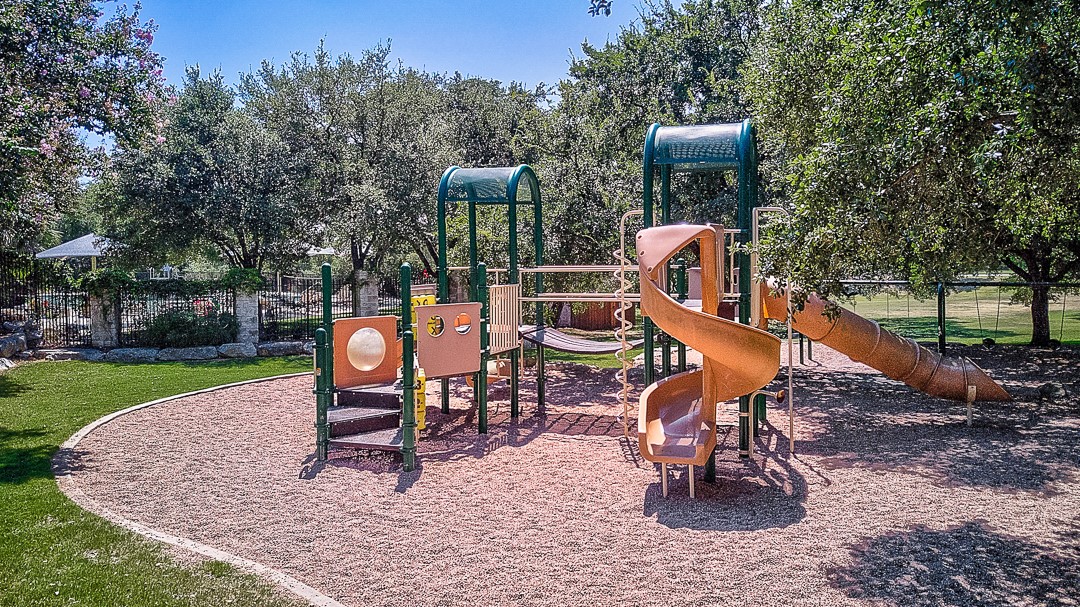12500 Simmental Drive Austin, TX 78732 - Photo 28 of 31 a table and chairs sitting in the park