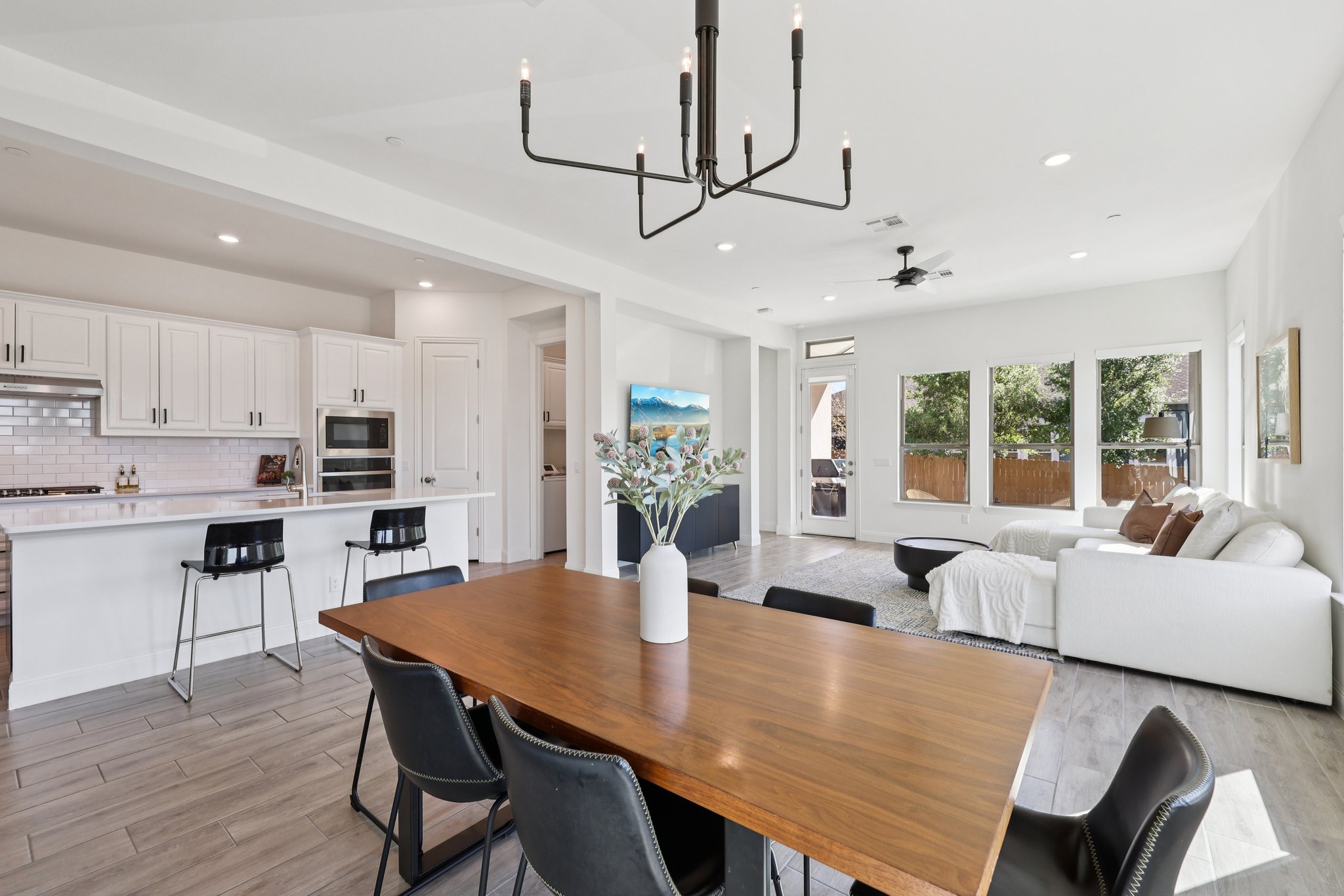 12500 Simmental Drive Austin, TX 78732 - Photo 4 of 31 a view of a dining room with furniture window and wooden floor