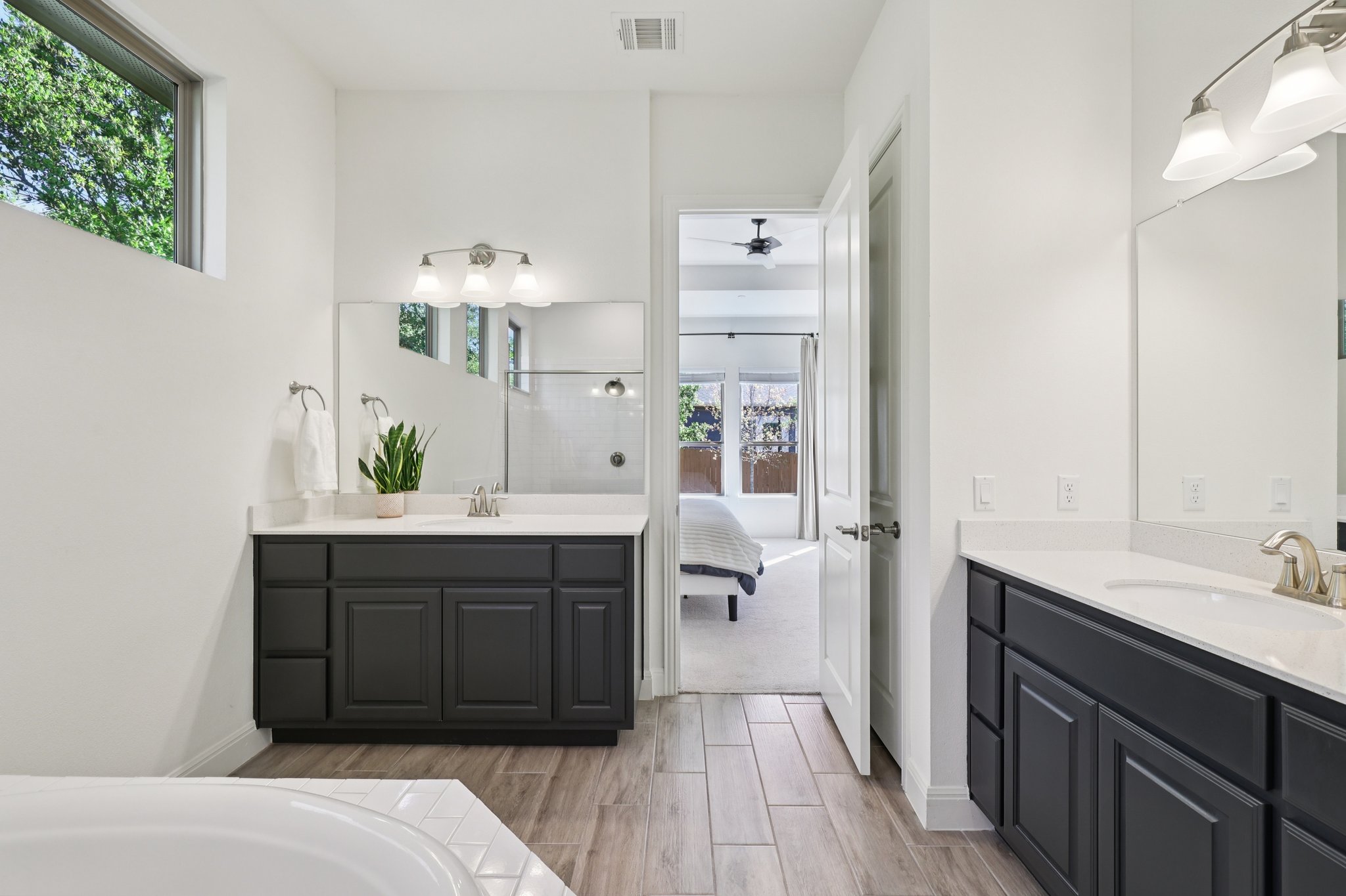 12500 Simmental Drive Austin, TX 78732 - Photo 7 of 31 a spacious bathroom with a sink and a mirror