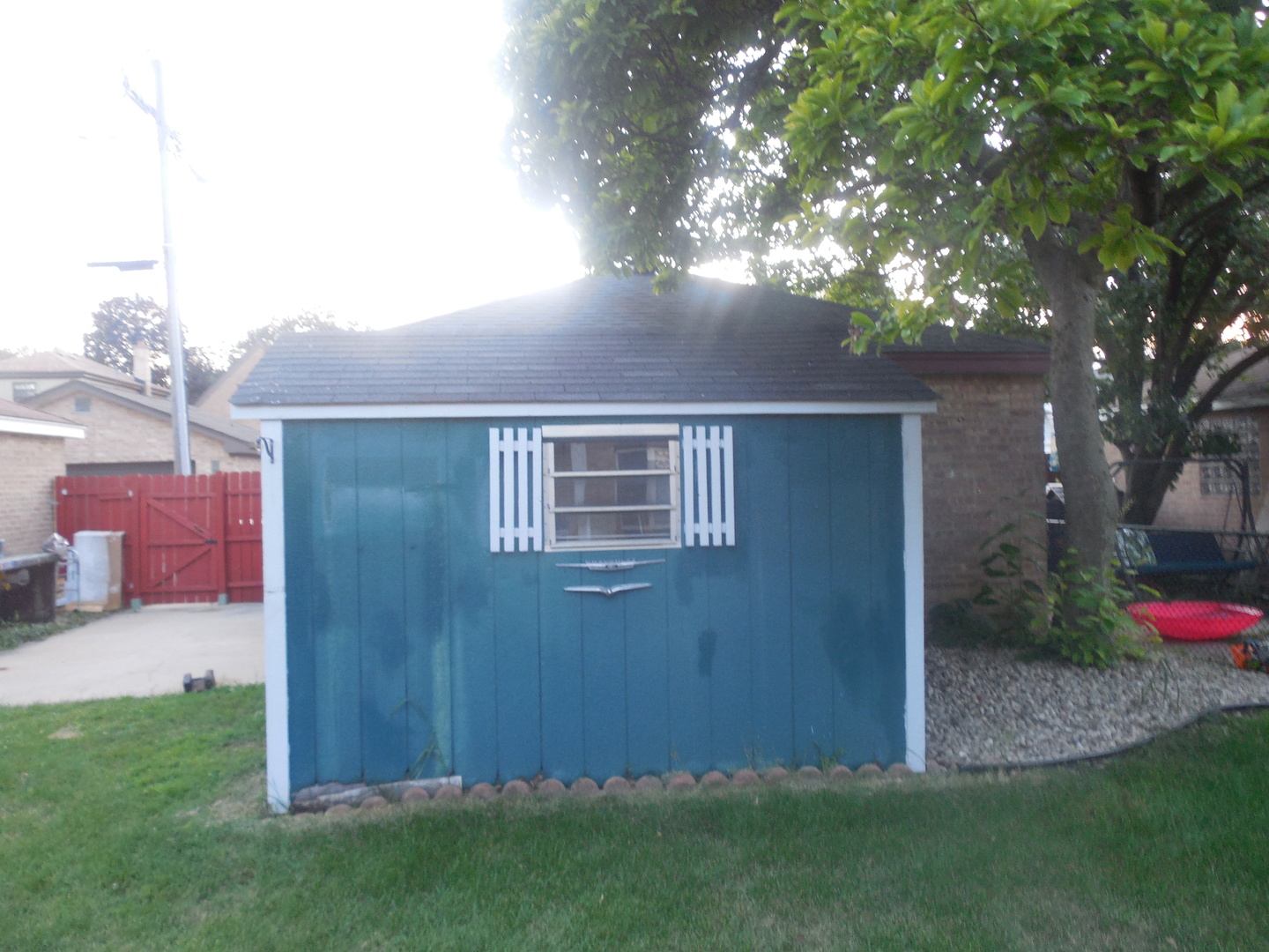 2236 11th Avenue Riverside, IL 60546 - Photo 3 of 20 a view of backyard with potted plants and a large tree