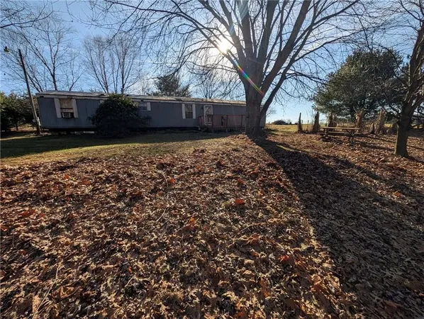 a view of house with yard