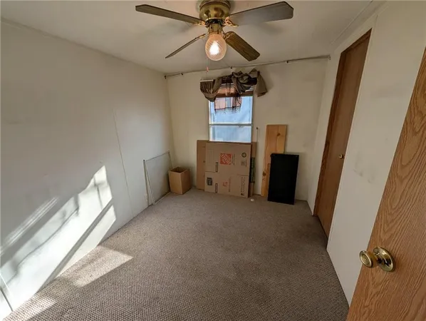 a bathroom with a toilet and a mirror