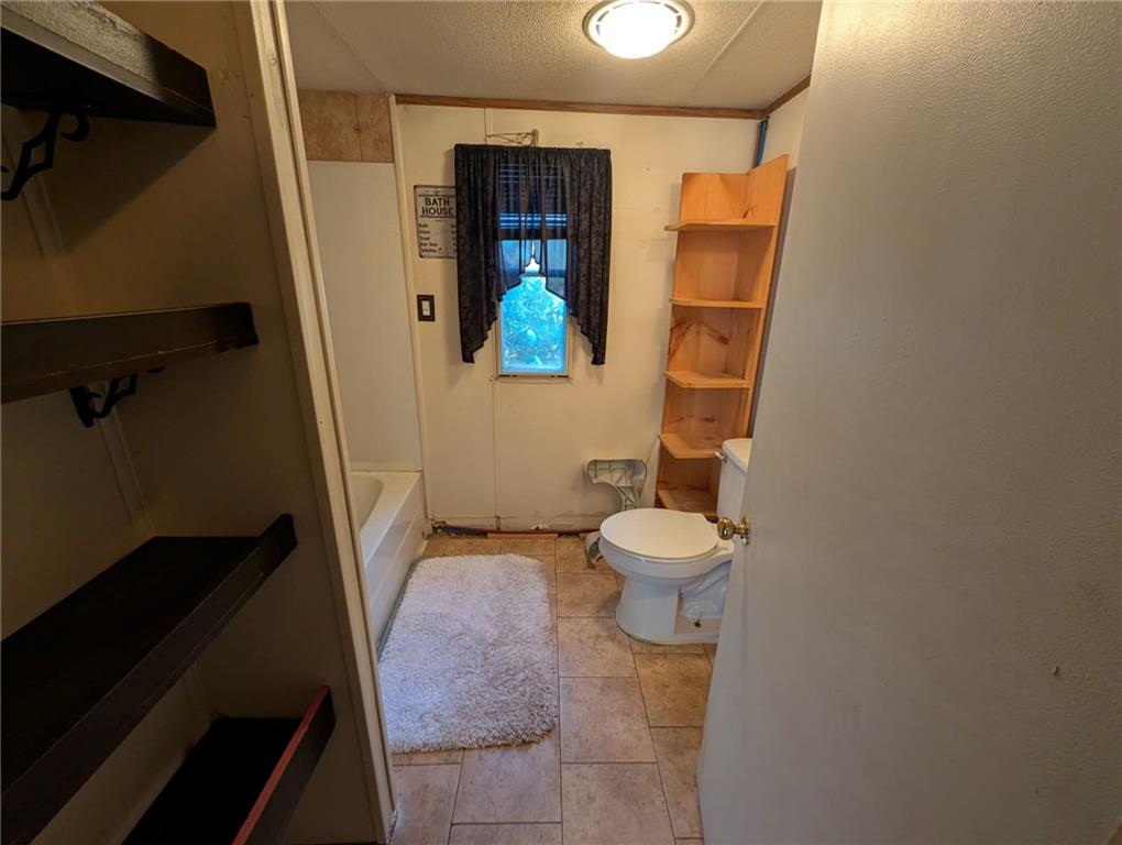 100 Santa Rita Lane Butler, PA 16001 - Photo 16 of 26 a bathroom with a toilet and a mirror