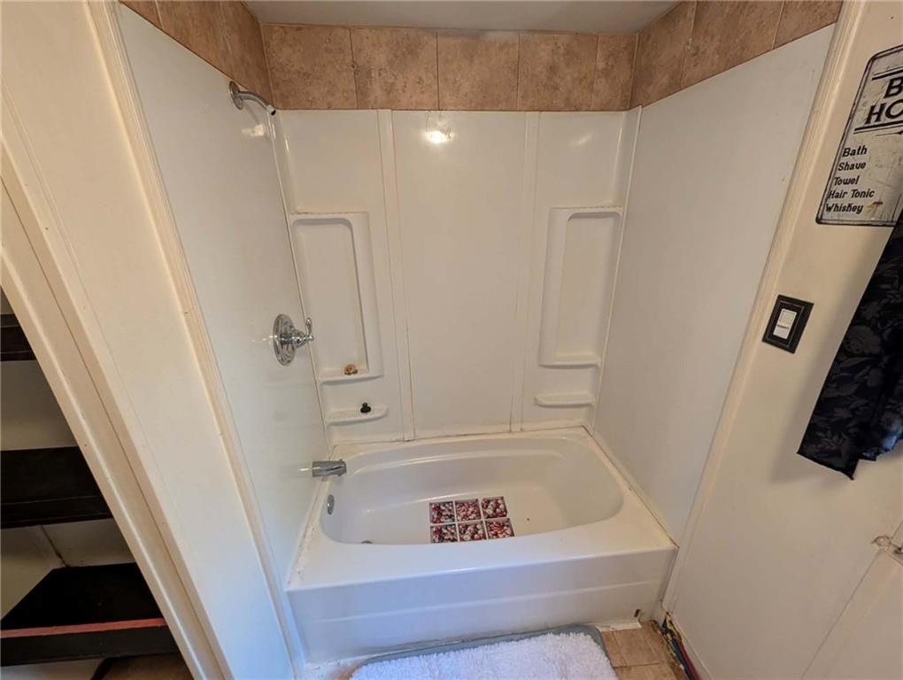 100 Santa Rita Lane Butler, PA 16001 - Photo 17 of 26 a bathroom with a tub and a shower