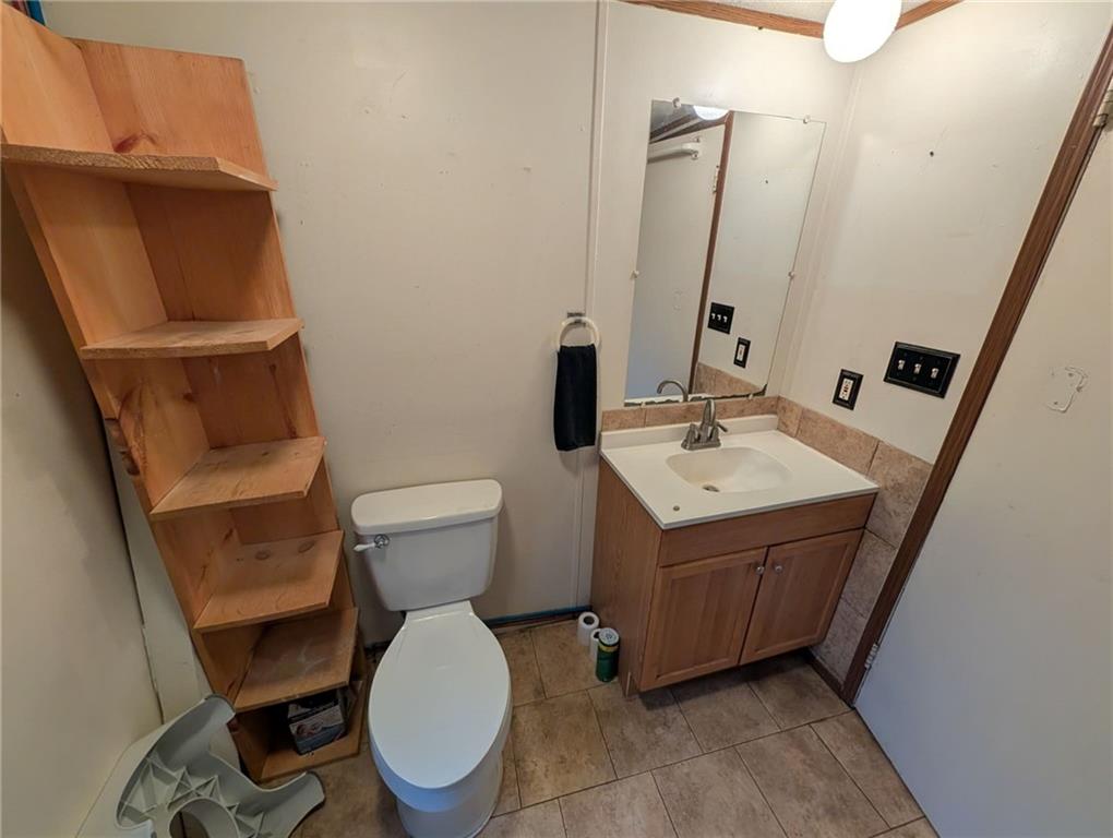 100 Santa Rita Lane Butler, PA 16001 - Photo 18 of 26 a bathroom with a sink toilet and mirror