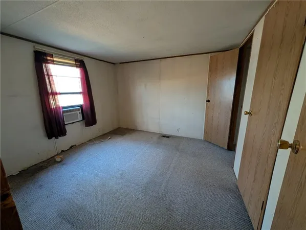 a view of storage and utility room with racks on the wall