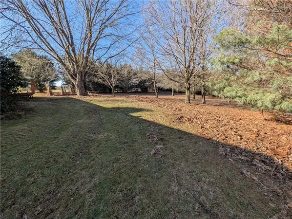 a view of a yard covered with snow