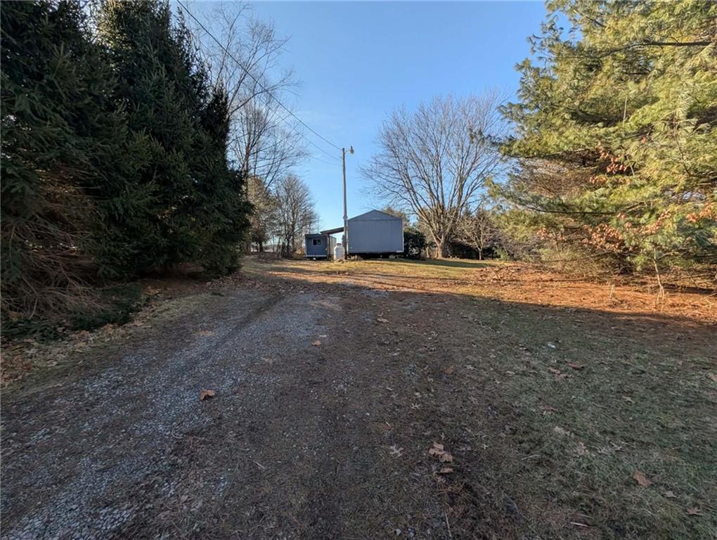 100 Santa Rita Lane Butler, PA 16001 - Photo 5 of 26 a view of a yard with a tree
