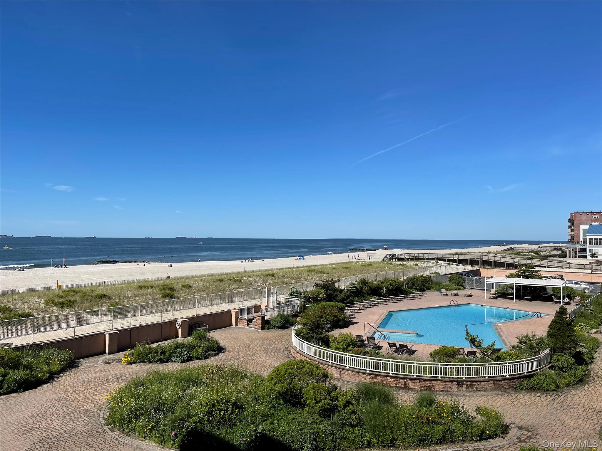 830 Shore Road, Unit 3E Long Beach, NY 11561 - Photo 13 of 13 an aerial view of ocean and residential houses with beach