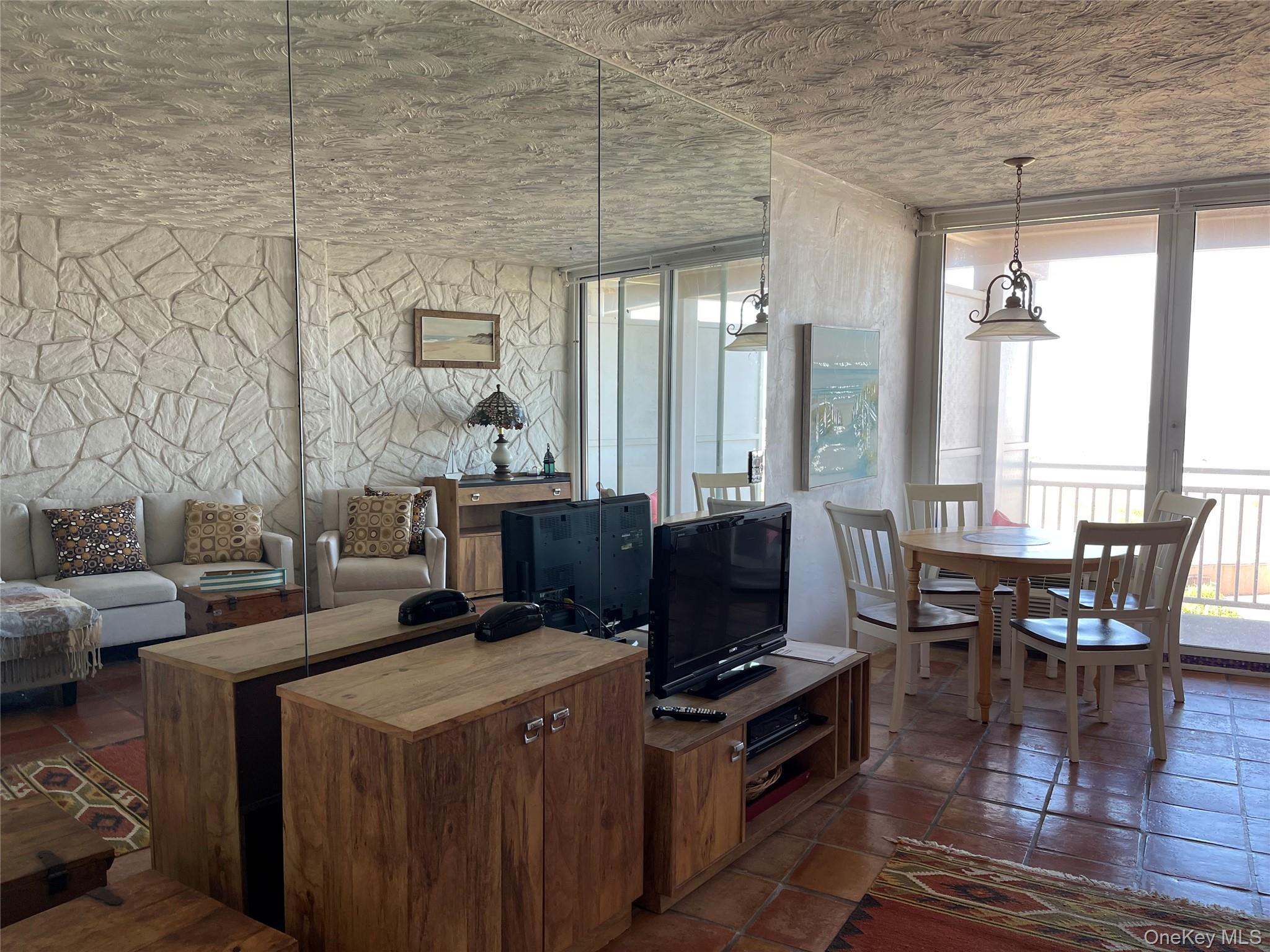 830 Shore Road, Unit 3E Long Beach, NY 11561 - Photo 8 of 13 a open kitchen with a table and chairs