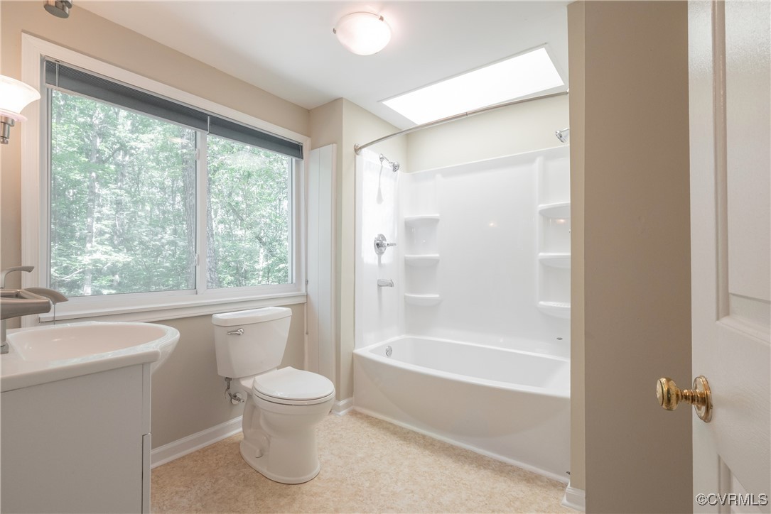 18729 Carson Road Dinwiddie, VA 23841 - Photo 27 of 49 a bathroom with a granite countertop sink a toilet and shower