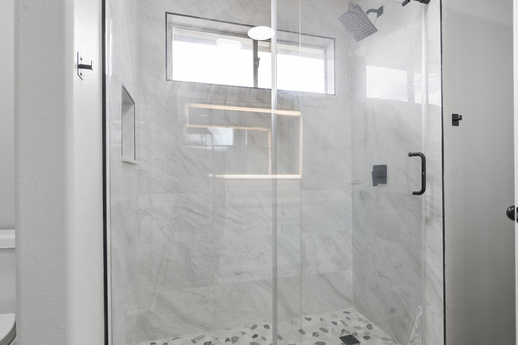 14211 Brunswick Point Lane Houston, TX 77047 - Photo 5 of 17 Renovated master bathroom with quartz countertops and custom tile walk in shower and LED Mirror