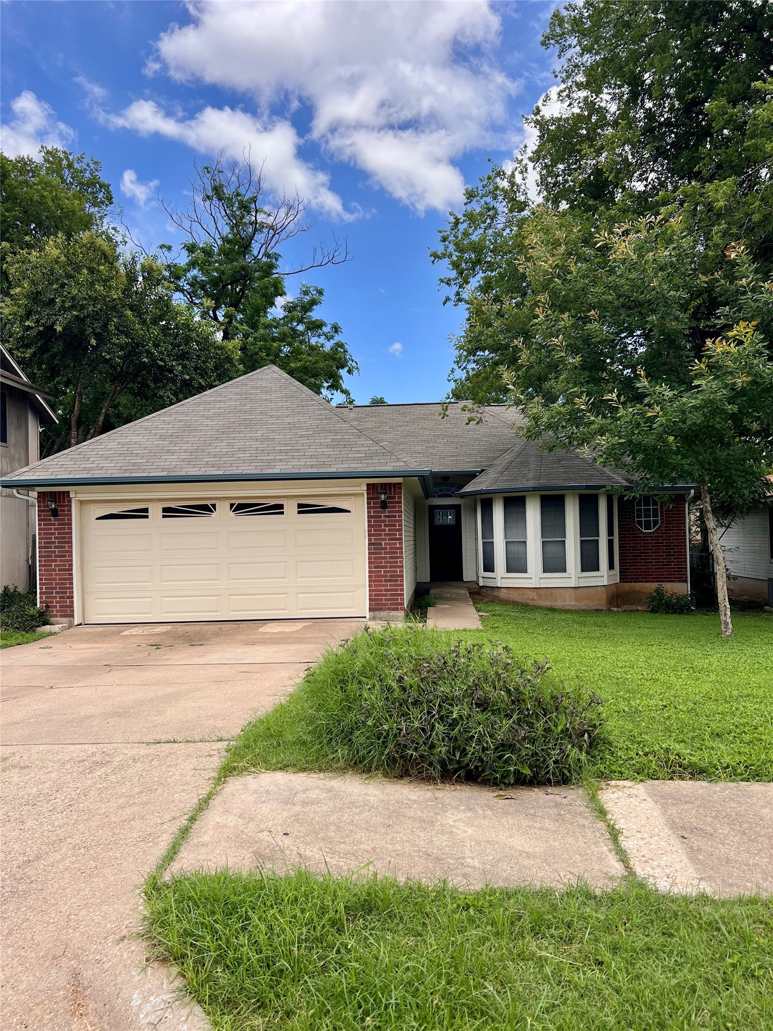 5404 China Berry Road Austin, TX 78744 - Photo 1 of 20 A classic brick exterior offers enduring charm with a practical attached garage and welcoming curb appeal.