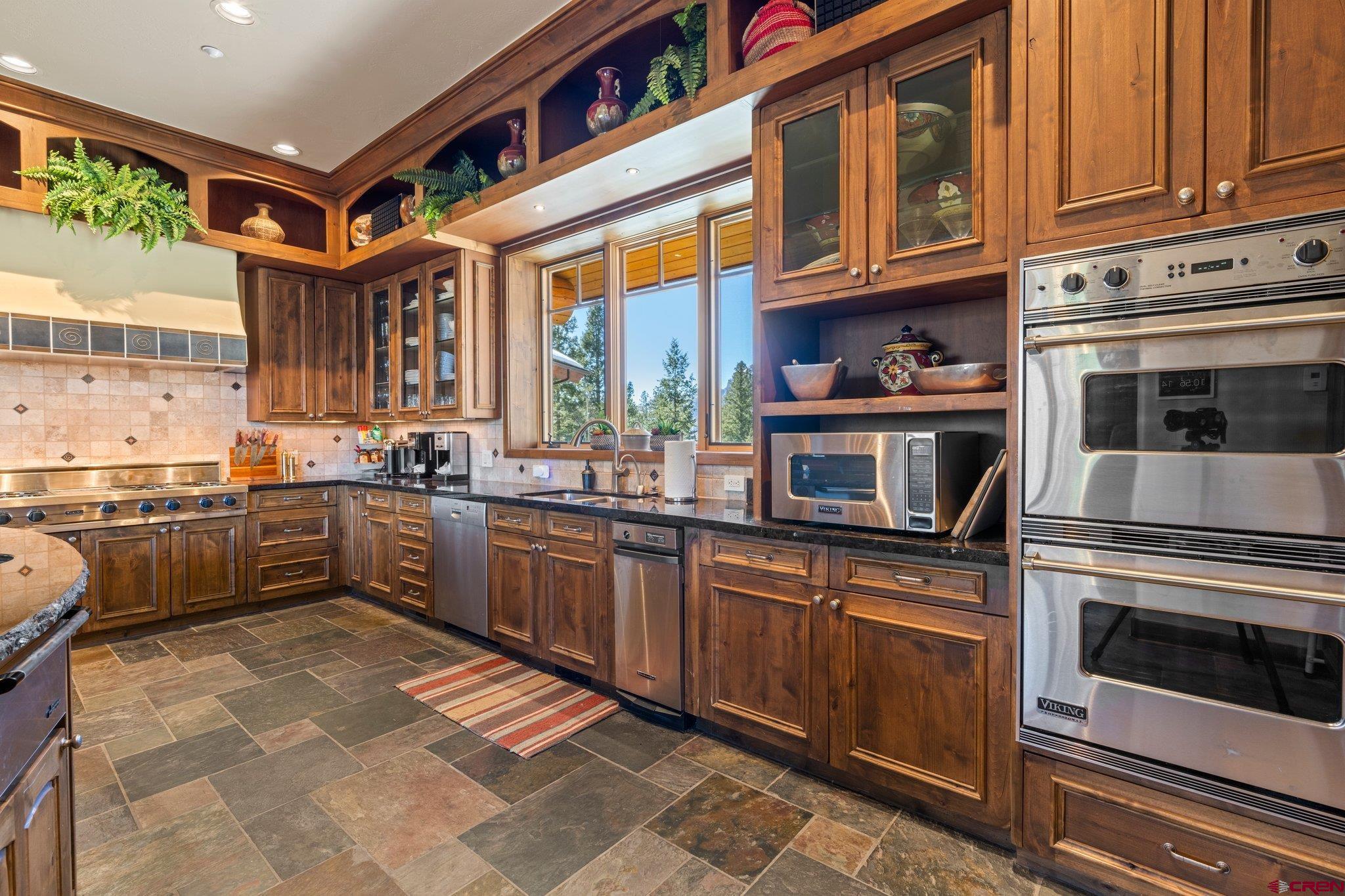 464 Pinnacle View Drive Durango, CO 81301 - Photo 12 of 35 a kitchen with stainless steel appliances granite countertop a stove and more cabinets