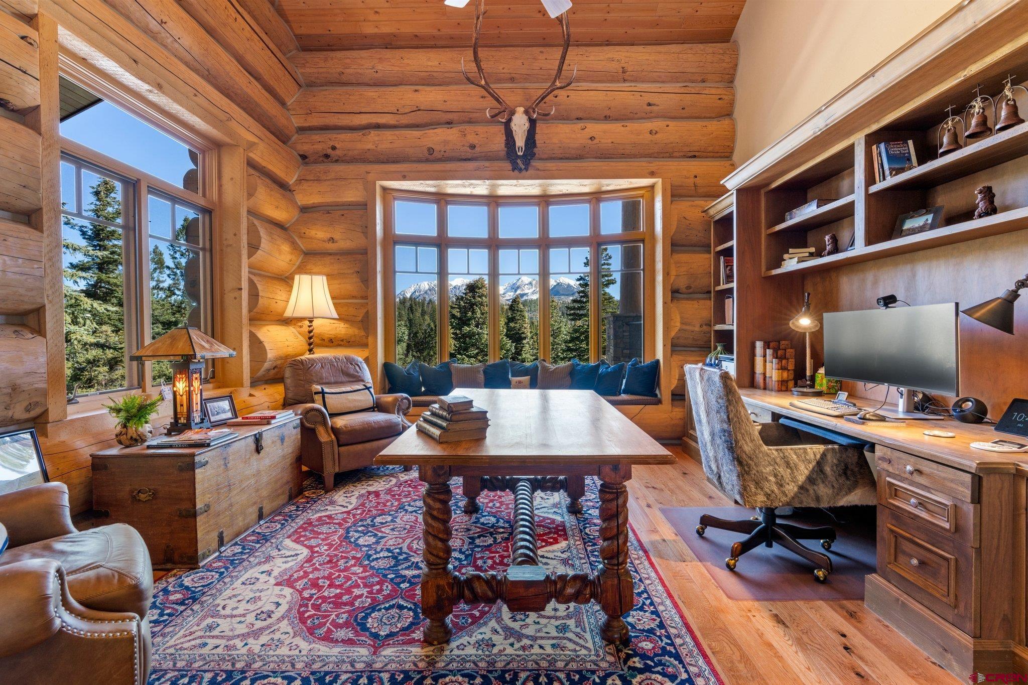 464 Pinnacle View Drive Durango, CO 81301 - Photo 13 of 35 a living room with furniture a rug and a large window