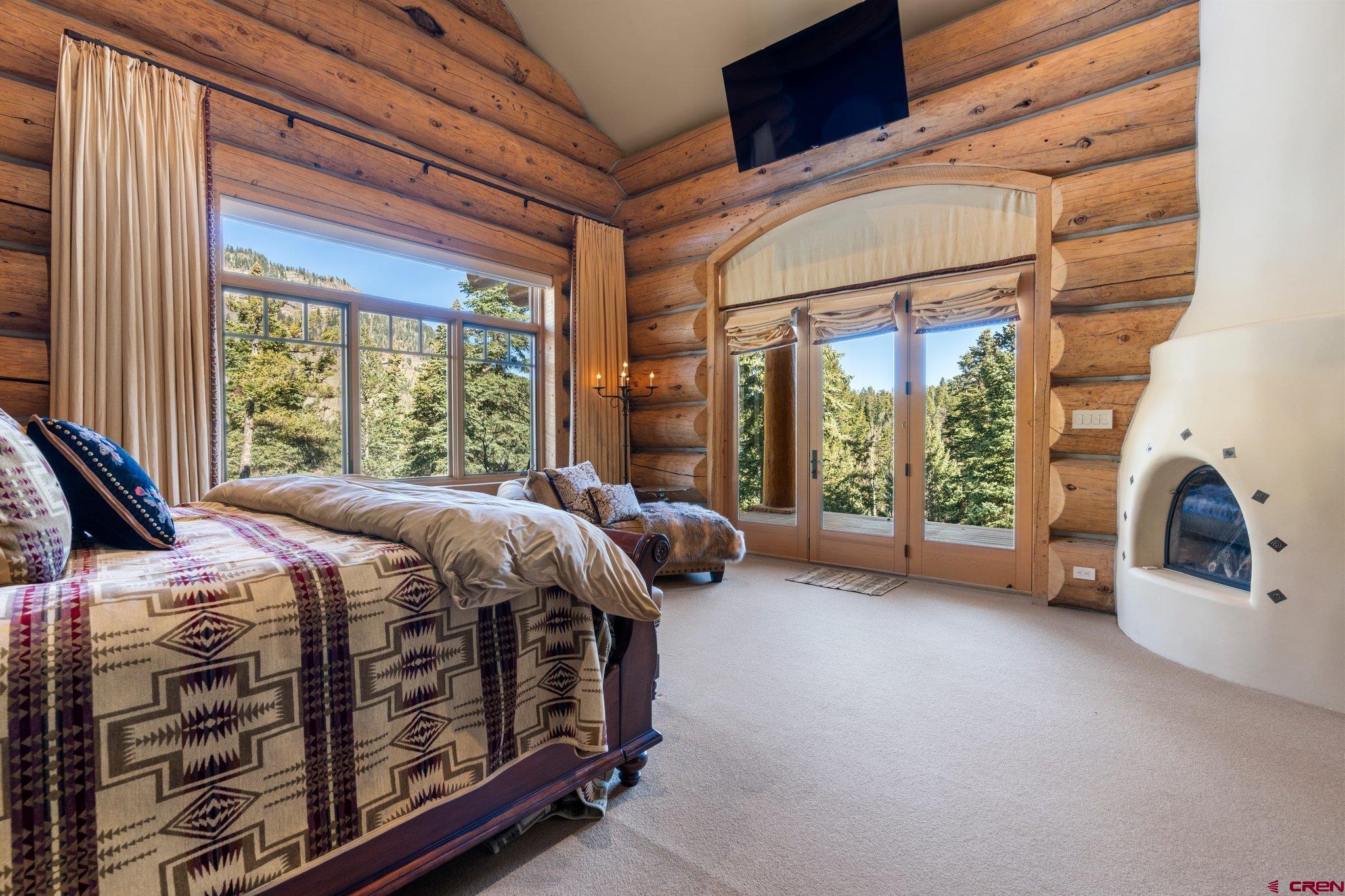 464 Pinnacle View Drive Durango, CO 81301 - Photo 14 of 35 a bed sitting in a room next to a balcony