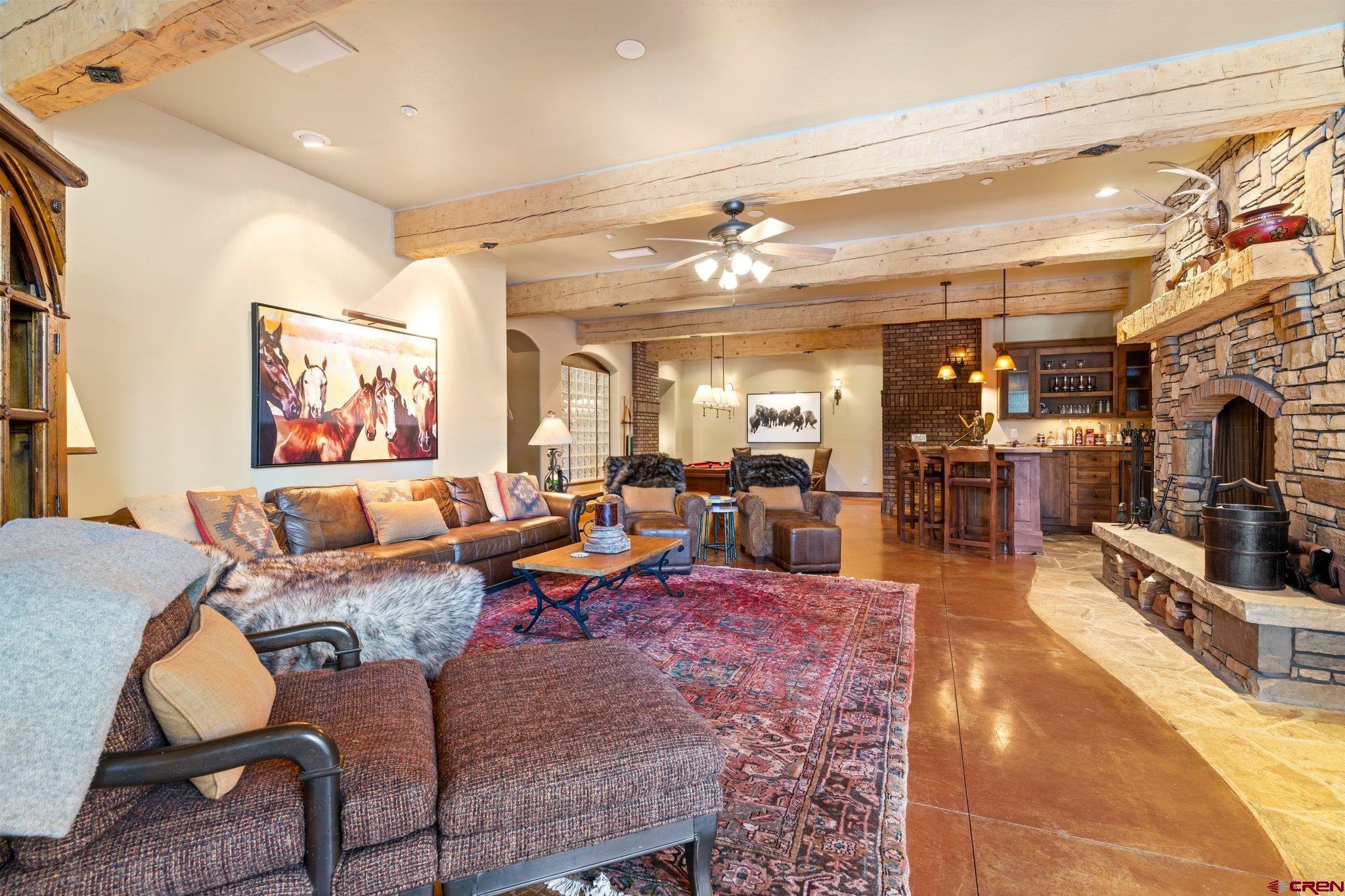 464 Pinnacle View Drive Durango, CO 81301 - Photo 28 of 35 a living room with lots of furniture and kitchen view