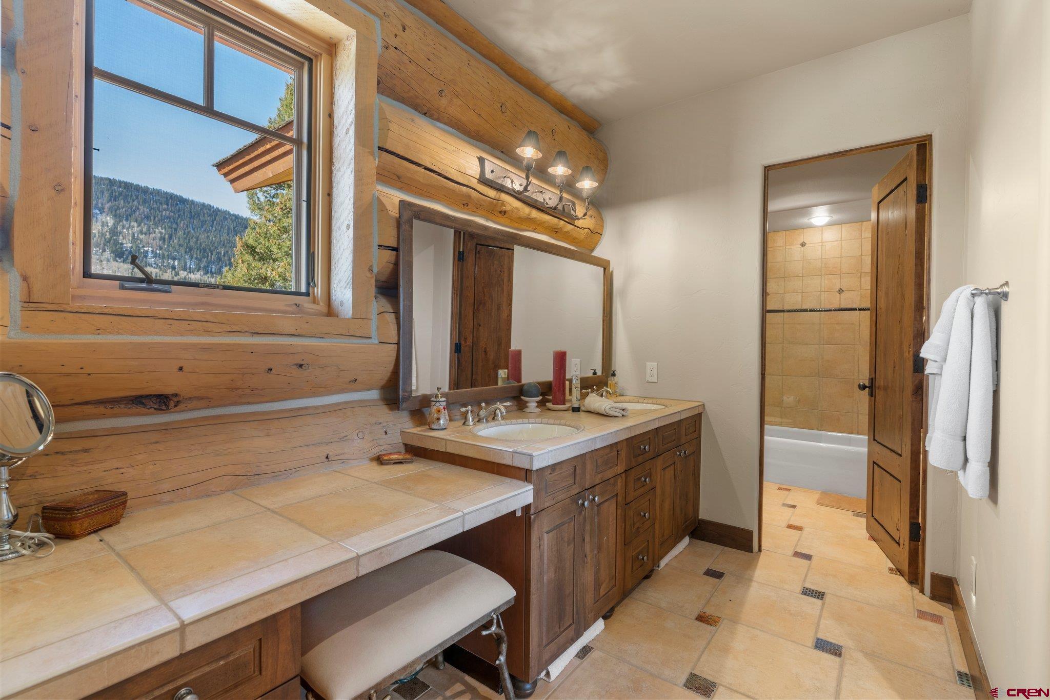 464 Pinnacle View Drive Durango, CO 81301 - Photo 33 of 35 a bathroom with a sink and a mirror