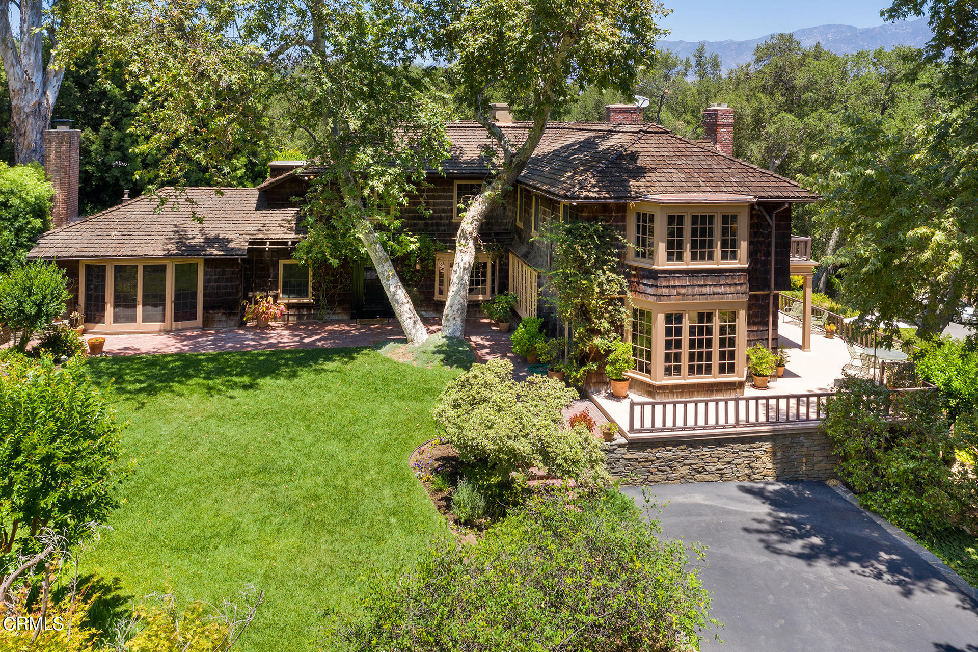 744 Rockwood Road Pasadena, CA 91105 - Photo 2 of 43 a front view of a house with a garden
