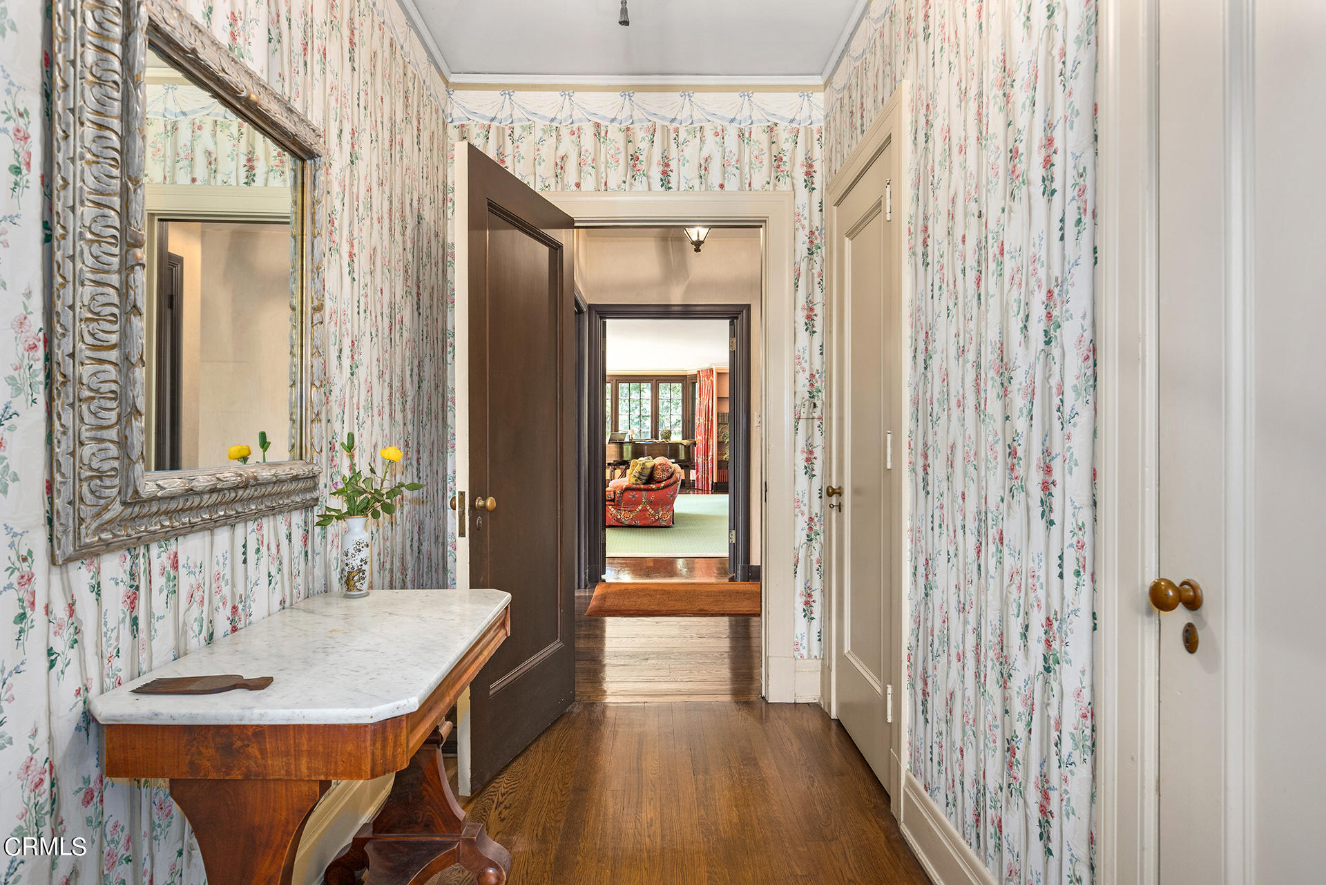 744 Rockwood Road Pasadena, CA 91105 - Photo 17 of 43 a view of a hallway with dining area wooden floor a chandelier