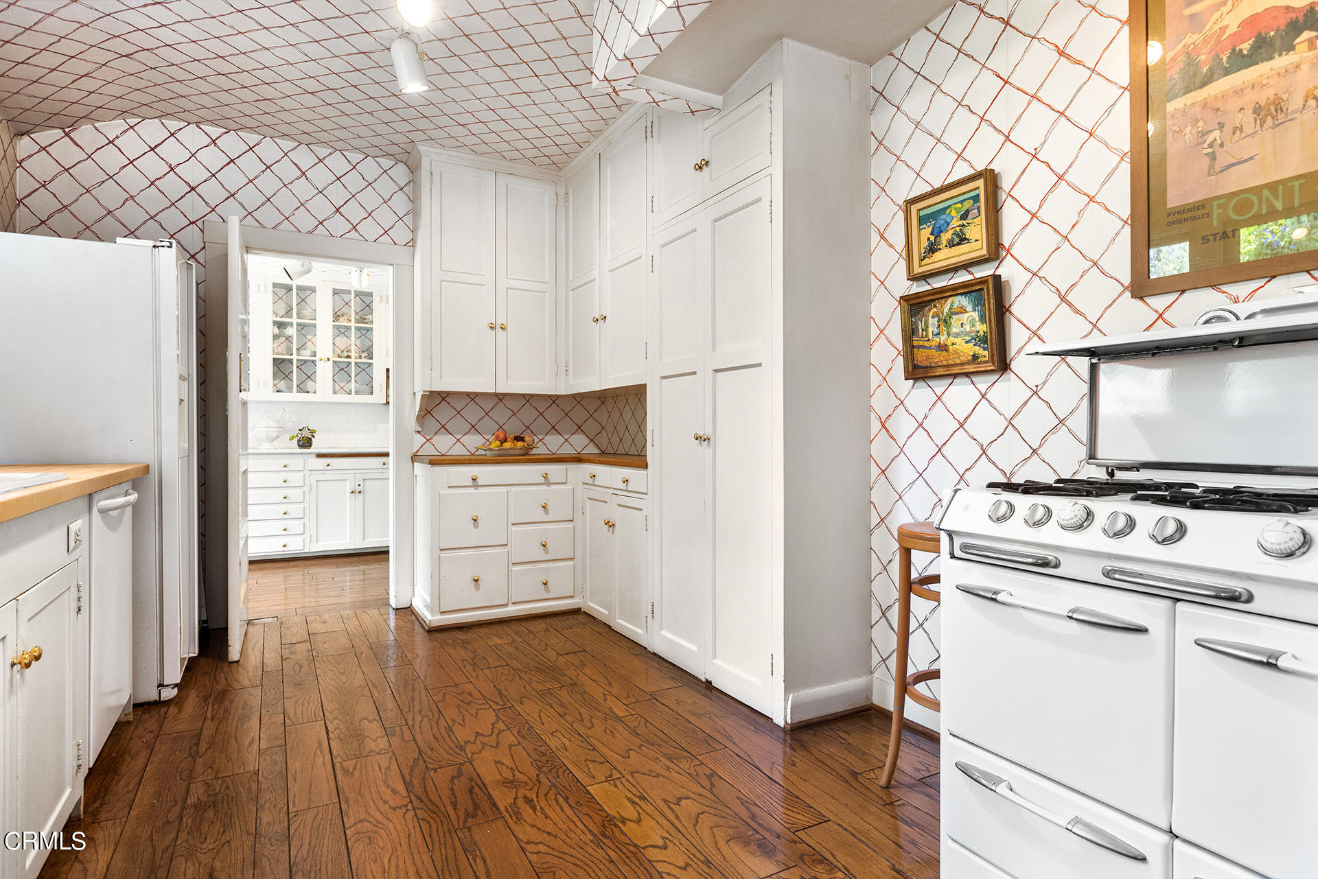 744 Rockwood Road Pasadena, CA 91105 - Photo 19 of 43 a kitchen with cabinets and wooden floor