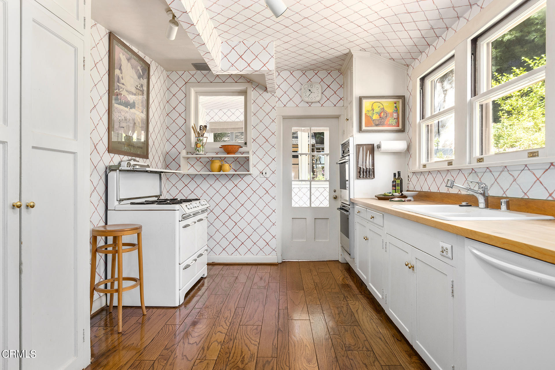 744 Rockwood Road Pasadena, CA 91105 - Photo 20 of 43 a kitchen with wooden floors and white walls