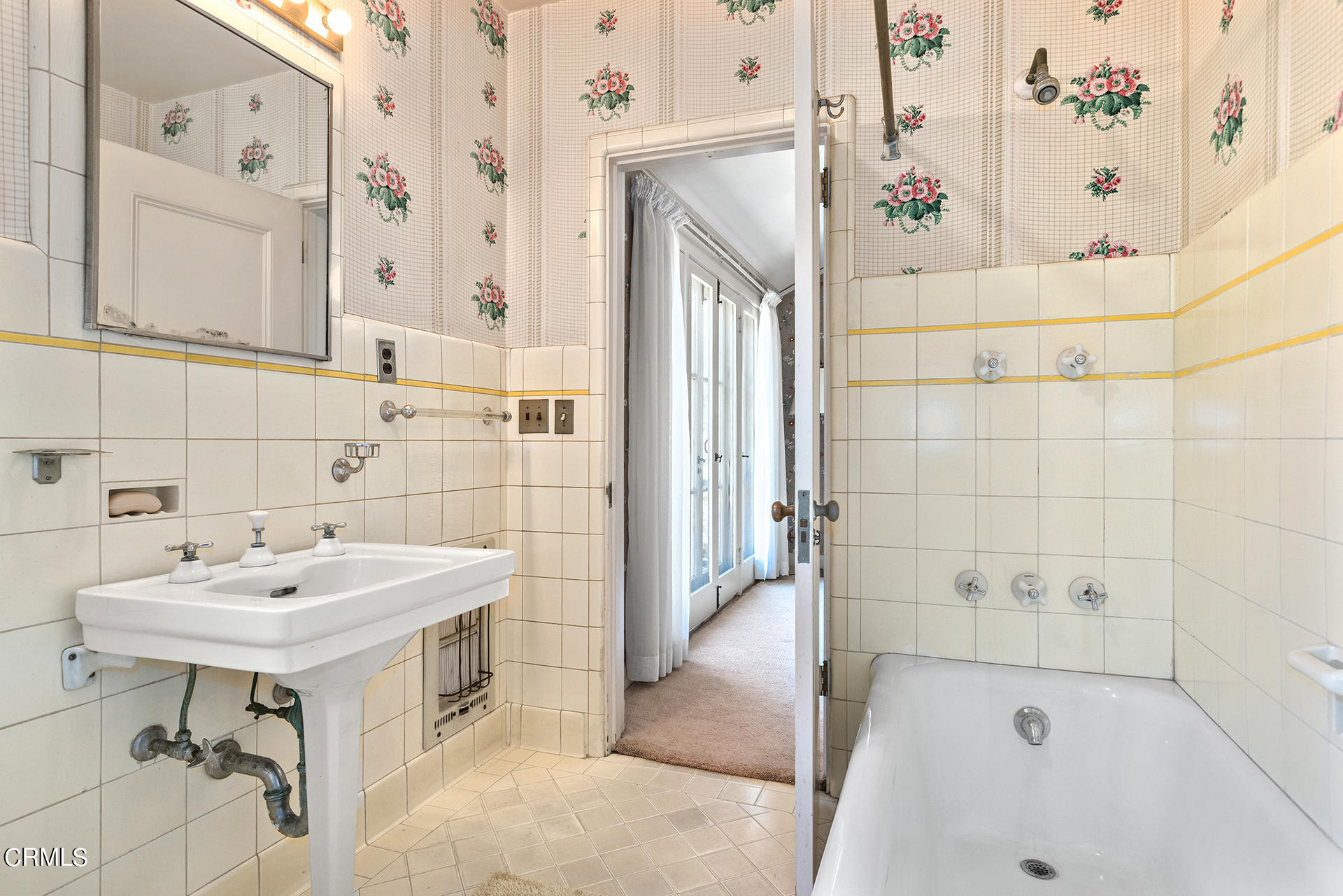 744 Rockwood Road Pasadena, CA 91105 - Photo 31 of 43 a bathroom with a sink and a mirror