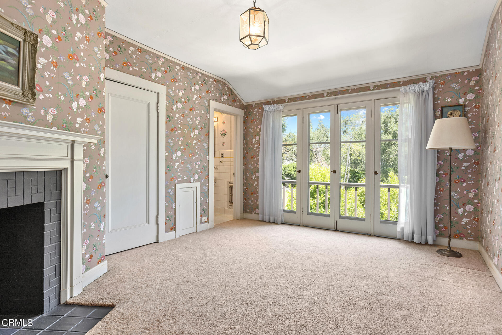 744 Rockwood Road Pasadena, CA 91105 - Photo 34 of 43 a view of an empty room with a fireplace and a window