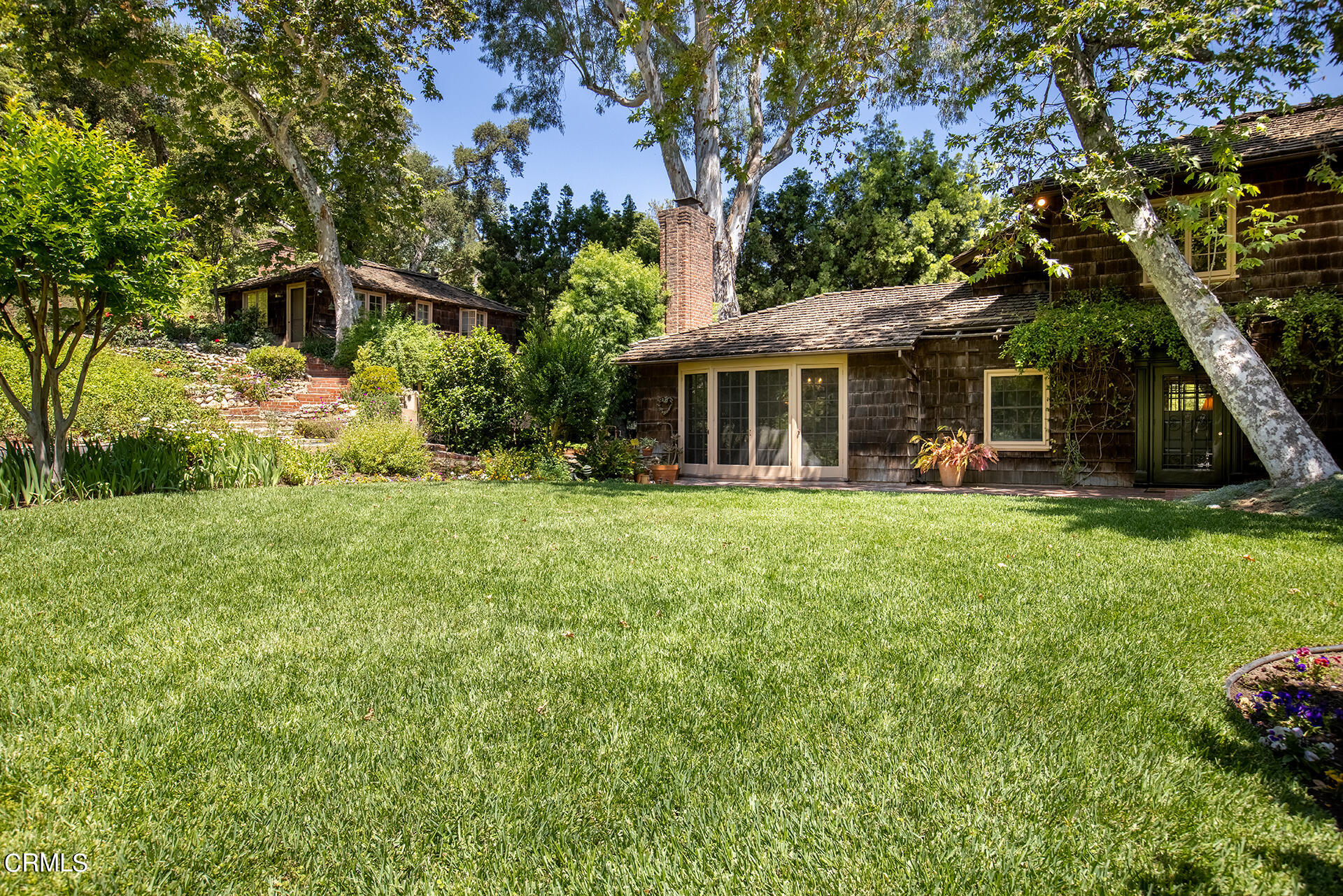 744 Rockwood Road Pasadena, CA 91105 - Photo 36 of 43 a front view of a house with garden