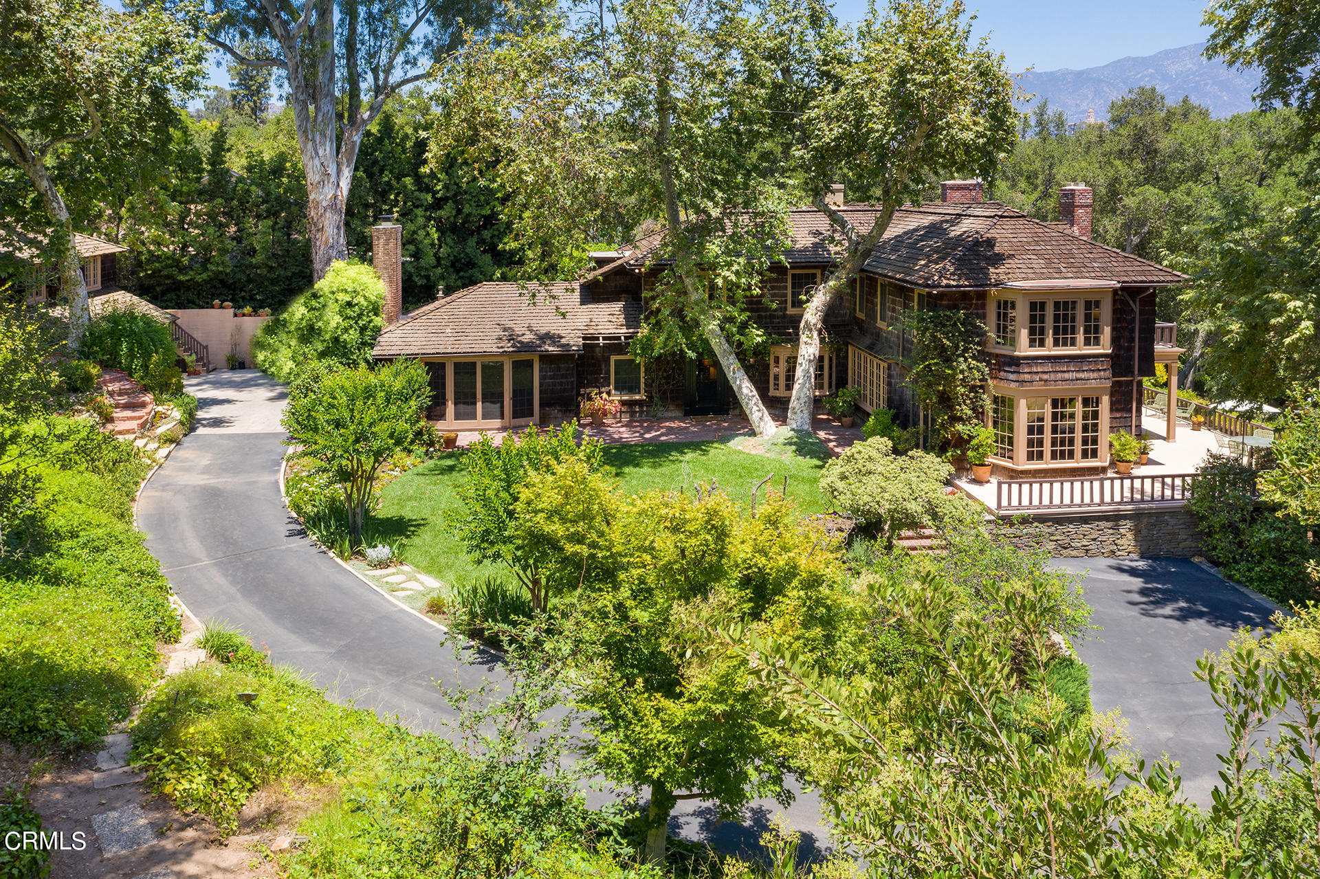 744 Rockwood Road Pasadena, CA 91105 - Photo 41 of 43 a front view of a house with a yard and fountain