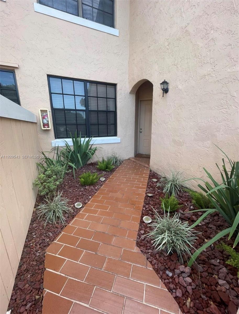 11864 Northwest 11th Street, Unit 11864 Pembroke Pines, FL 33026 - Photo 11 of 13 a front view of a house