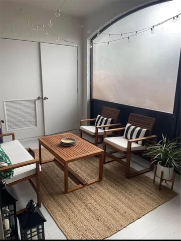 a reading room with furniture and wooden floor