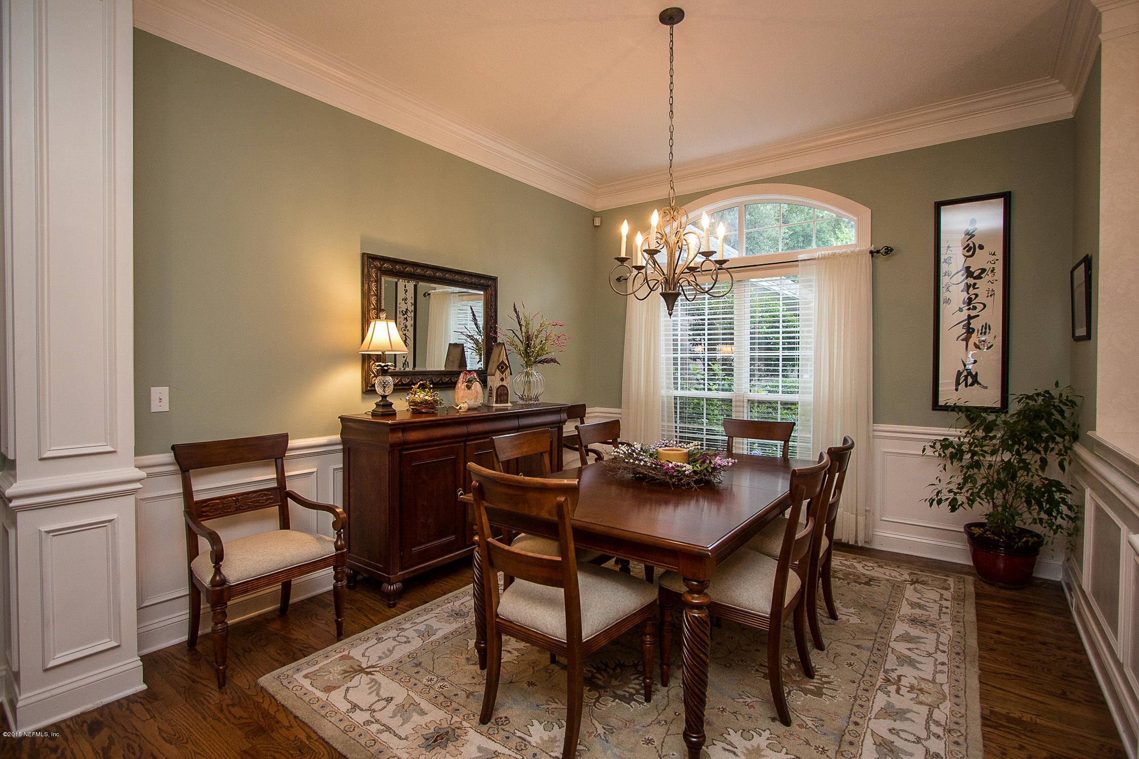3122 Nautilus Road Middleburg, FL 32068 - Photo 16 of 64 a view of a dining room with furniture window and wooden floor
