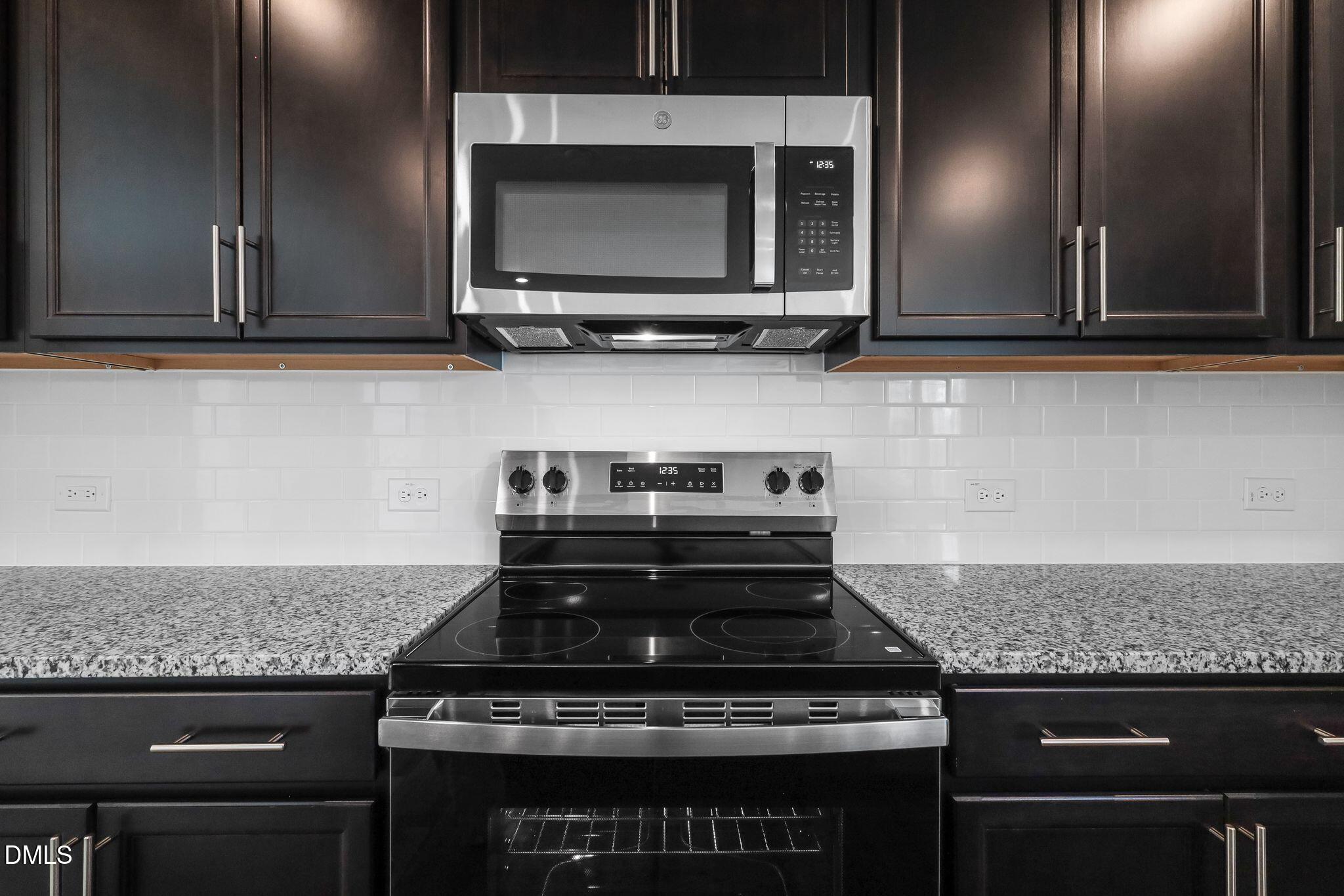 5818 Millstone Way Sims, NC 27880 - Photo 9 of 24 a stove top oven sitting inside of a kitchen