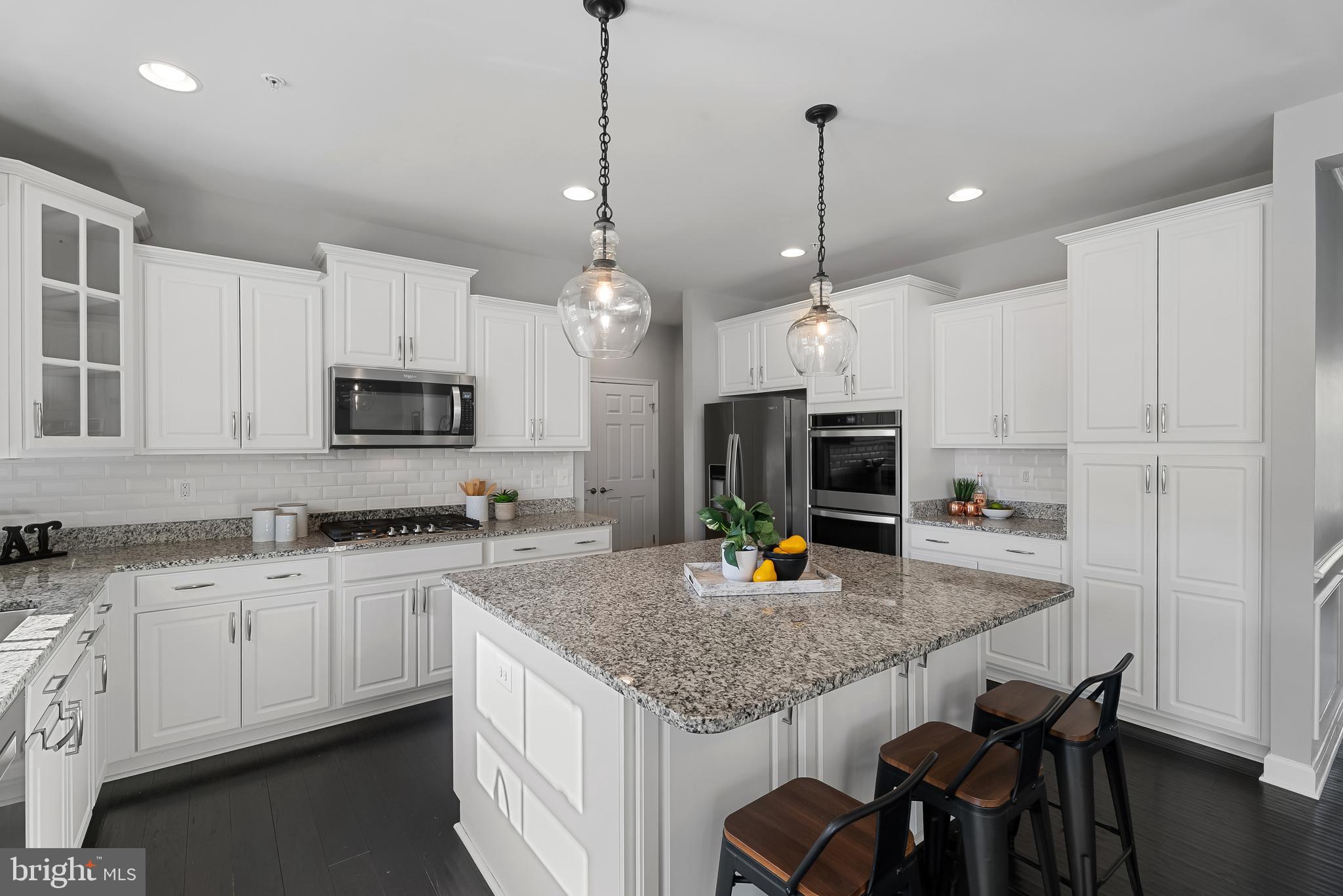815 Holden Road Frederick, MD 21701 - Photo 18 of 59 a kitchen with sink a microwave and cabinets
