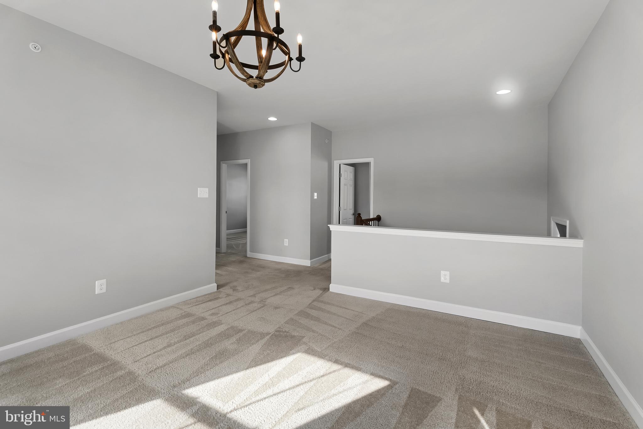 815 Holden Road Frederick, MD 21701 - Photo 23 of 59 a view of a room with a sink and chandelier