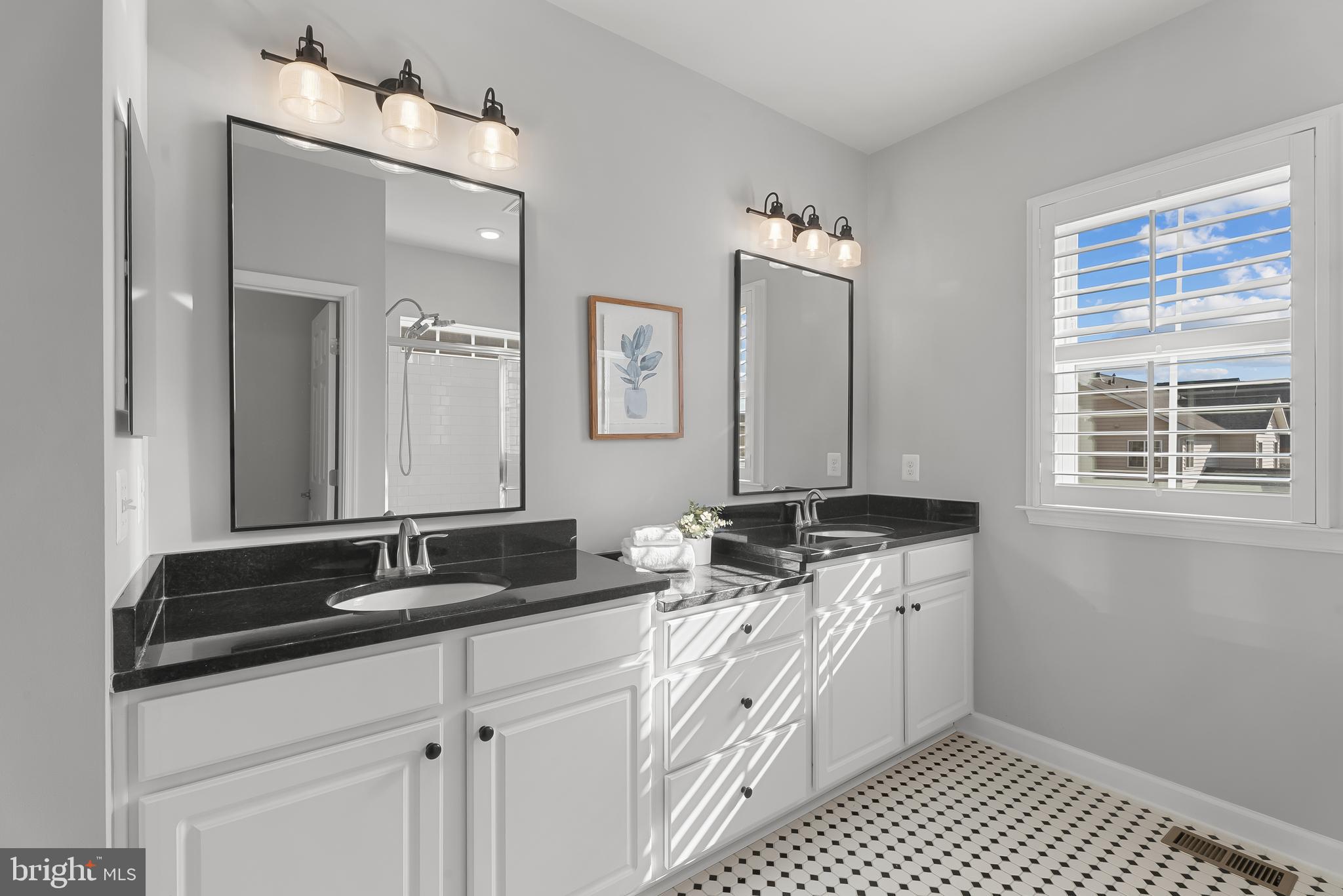 815 Holden Road Frederick, MD 21701 - Photo 27 of 59 a spacious bathroom with a granite countertop sink a mirror and a