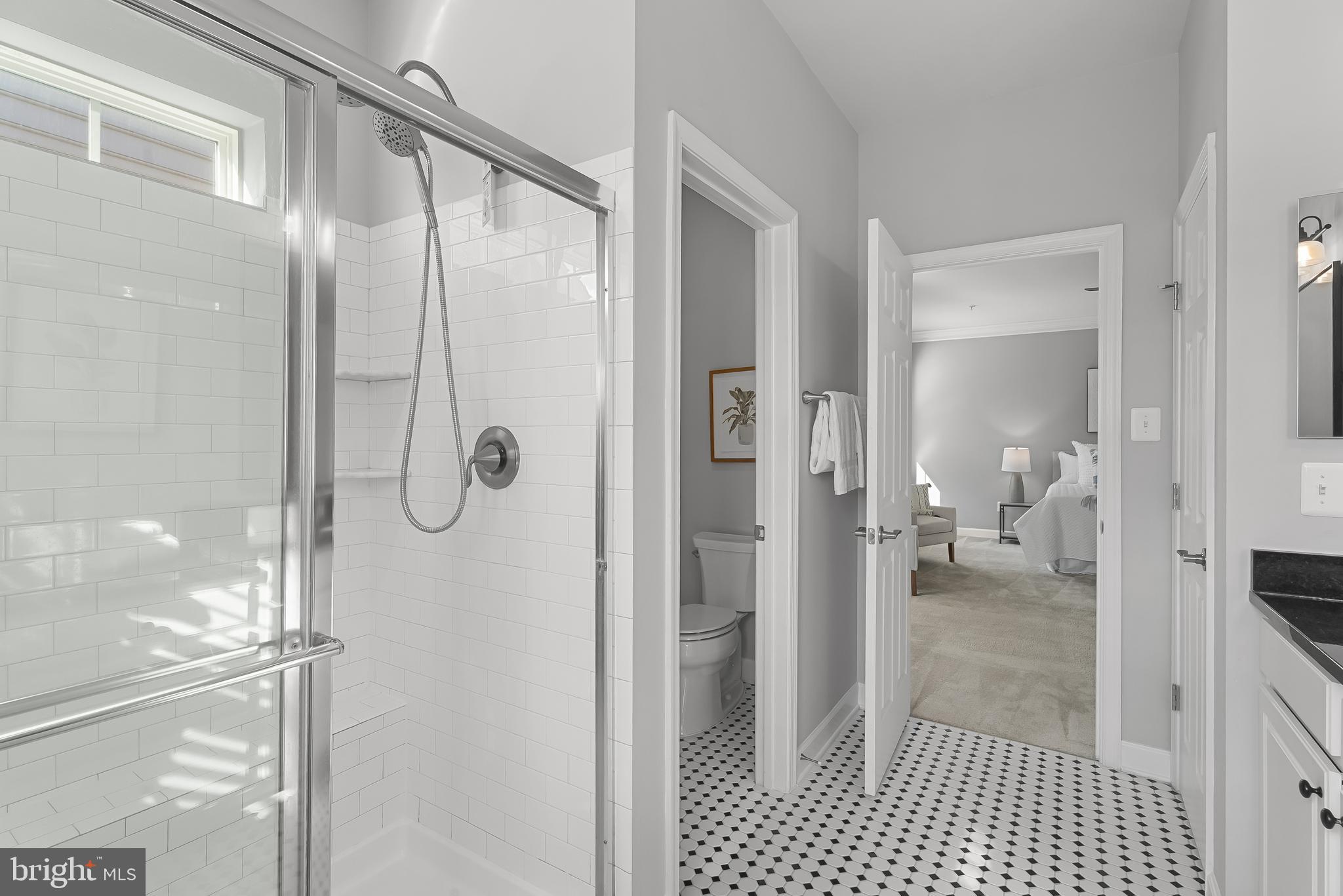 815 Holden Road Frederick, MD 21701 - Photo 28 of 59 a bathroom with a glass shower door