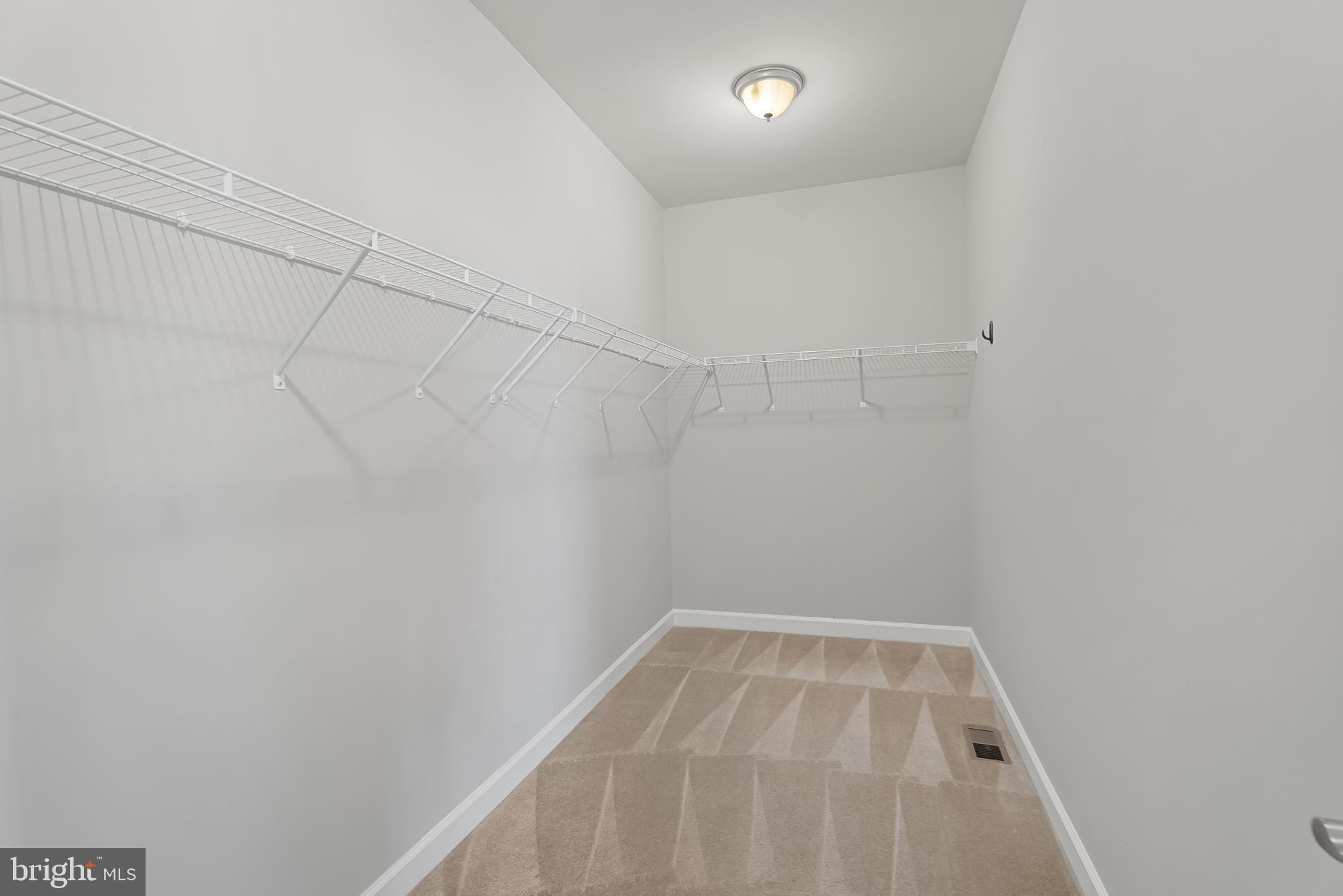 815 Holden Road Frederick, MD 21701 - Photo 29 of 59 a view of a room with racks on the wall