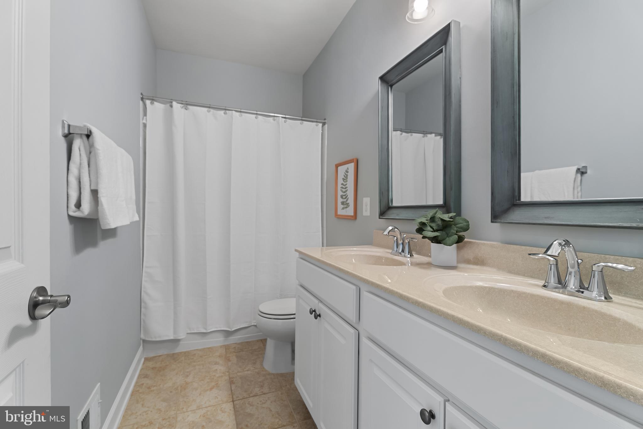 815 Holden Road Frederick, MD 21701 - Photo 36 of 59 a bathroom with a granite countertop sink and a mirror