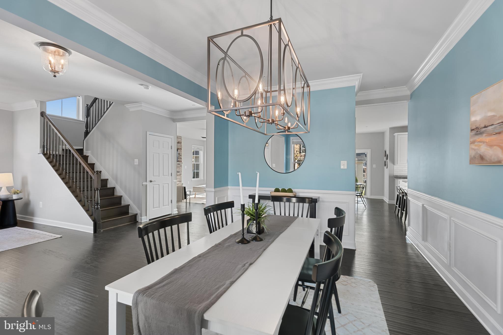 815 Holden Road Frederick, MD 21701 - Photo 10 of 59 a view of a dining room with furniture a chandelier and wooden floor