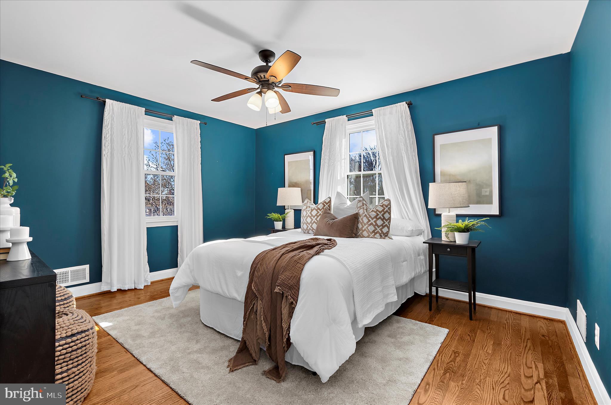 312 Small Court Catonsville, MD 21228 - Photo 19 of 41 a bedroom with a bed and a chandelier