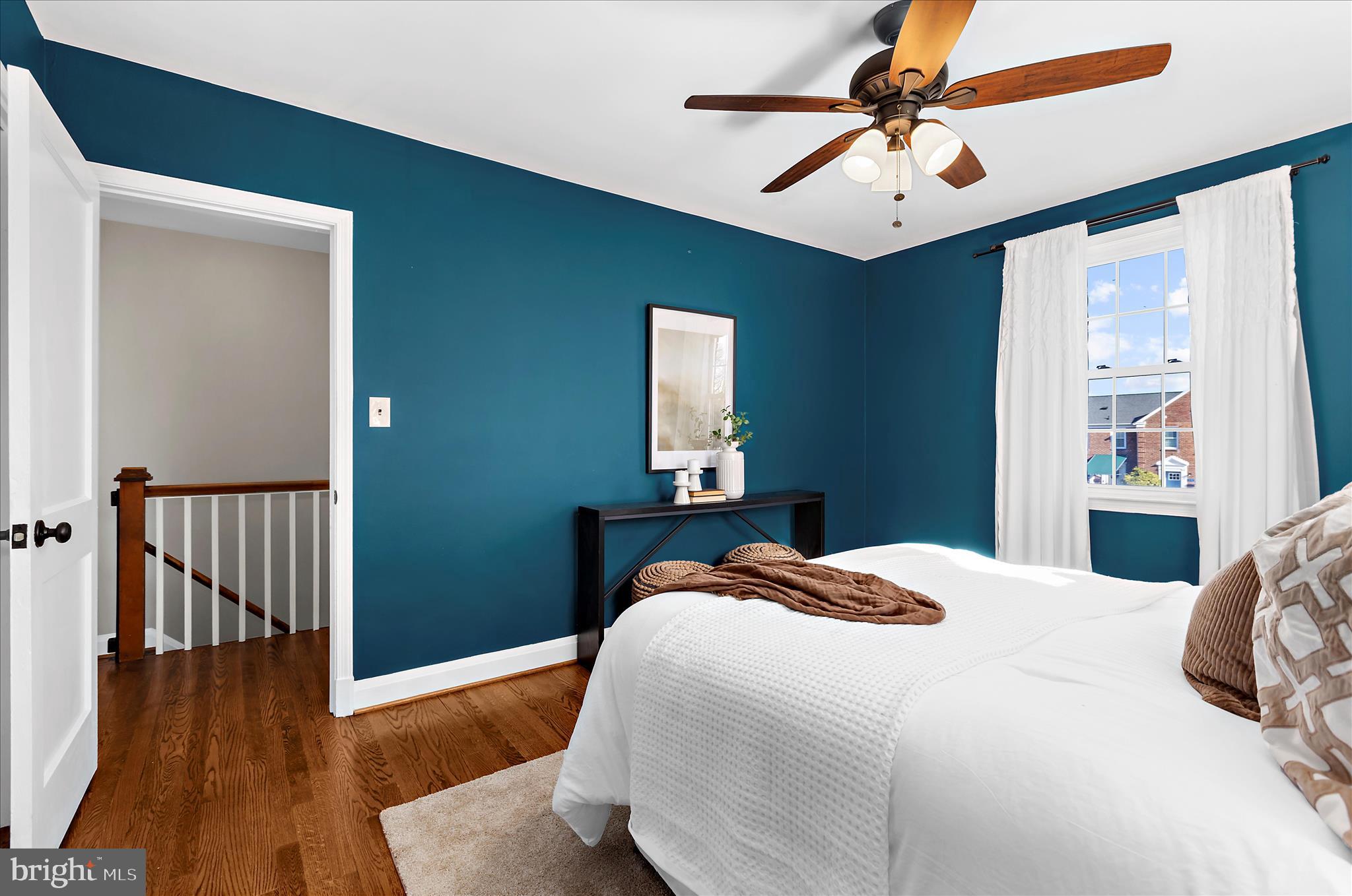 312 Small Court Catonsville, MD 21228 - Photo 20 of 41 a bedroom with a bed and a chandelier