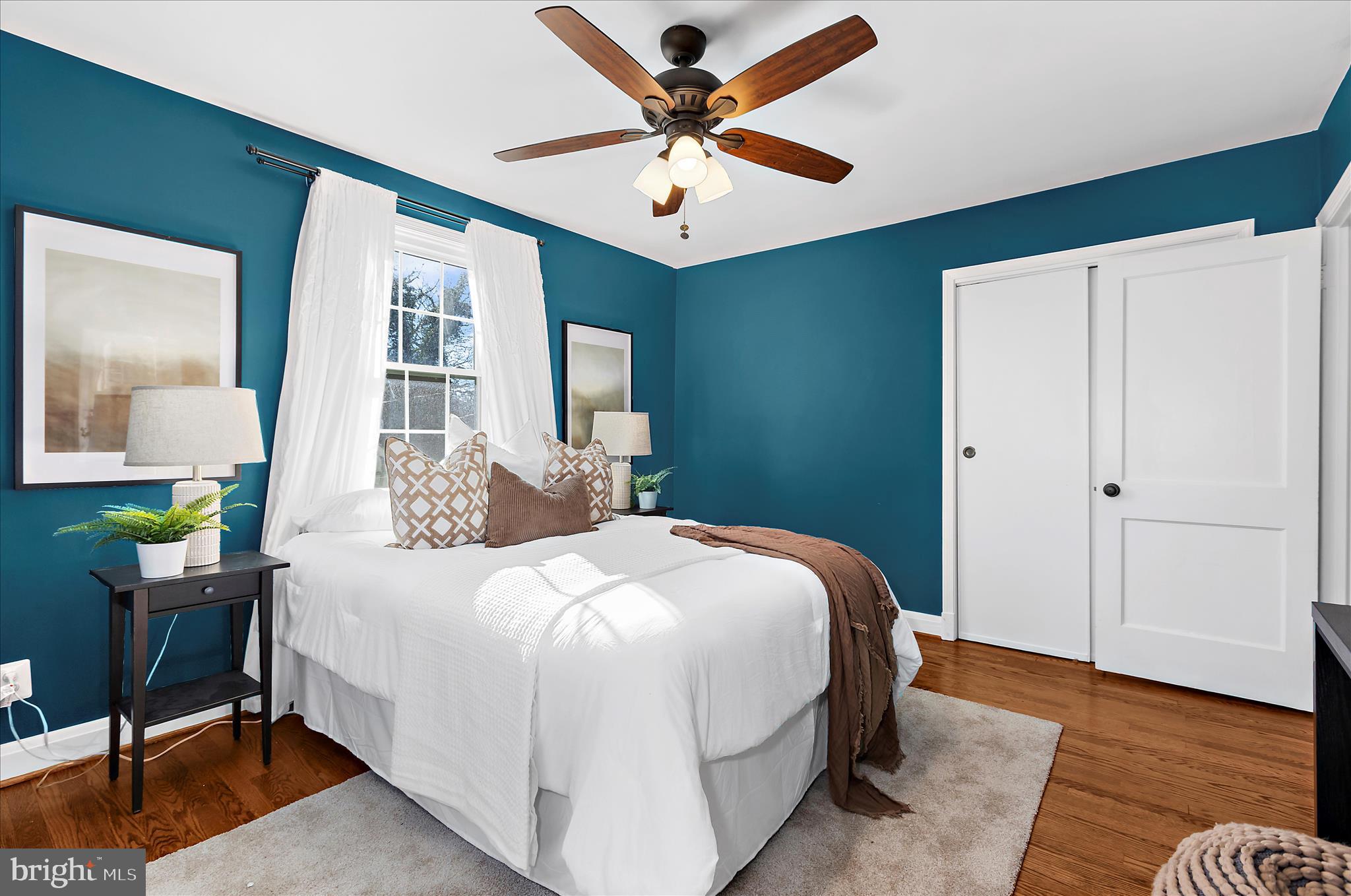 312 Small Court Catonsville, MD 21228 - Photo 21 of 41 a bedroom with a bed and a chandelier