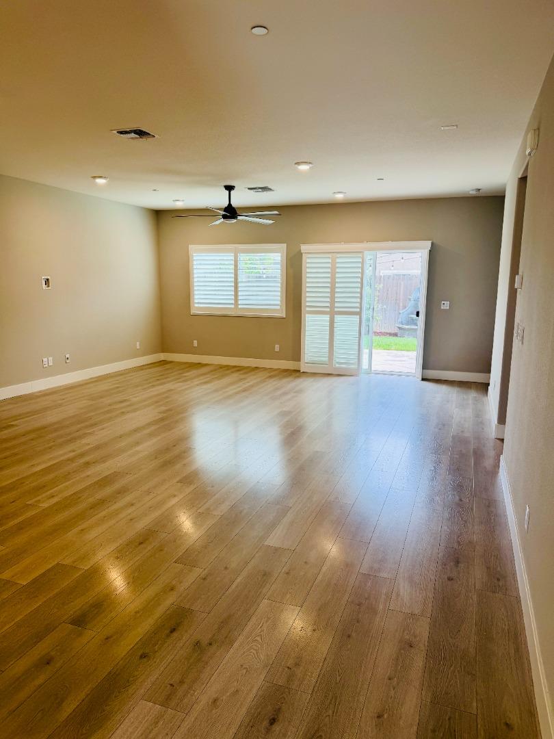 1946 Pollock Way Lodi, CA 95242 - Photo 12 of 35 a view of an empty room with wooden floor
