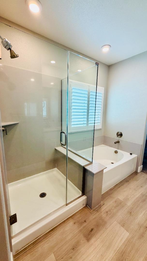 1946 Pollock Way Lodi, CA 95242 - Photo 30 of 35 a bathroom with a tub and a shower