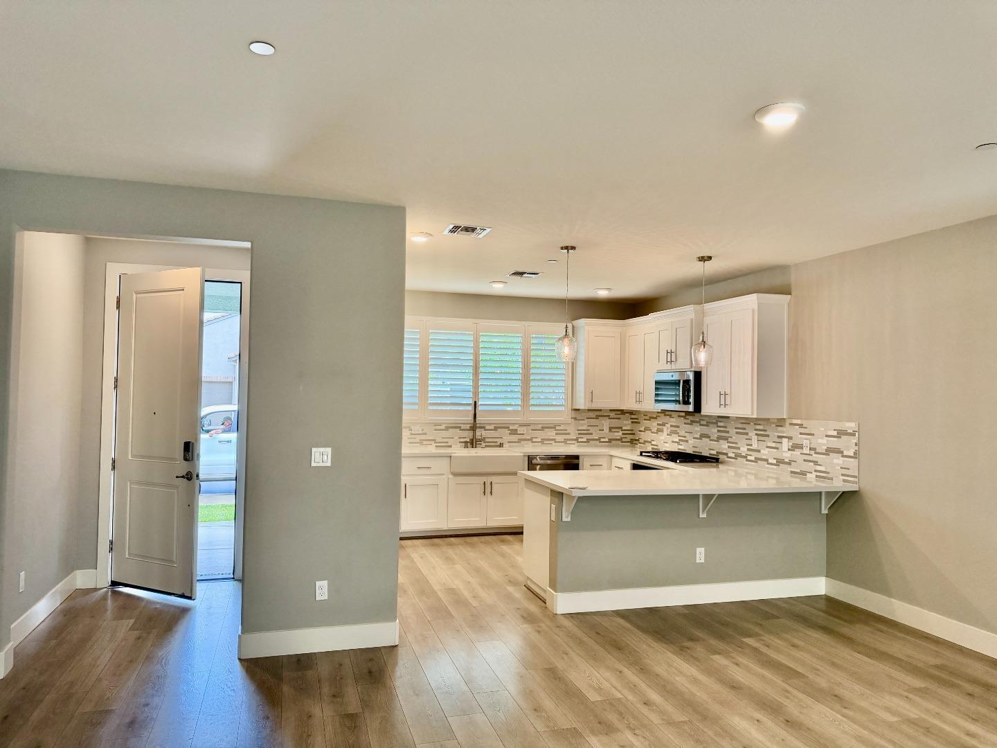 1946 Pollock Way Lodi, CA 95242 - Photo 5 of 35 a kitchen with a stove a sink and a refrigerator