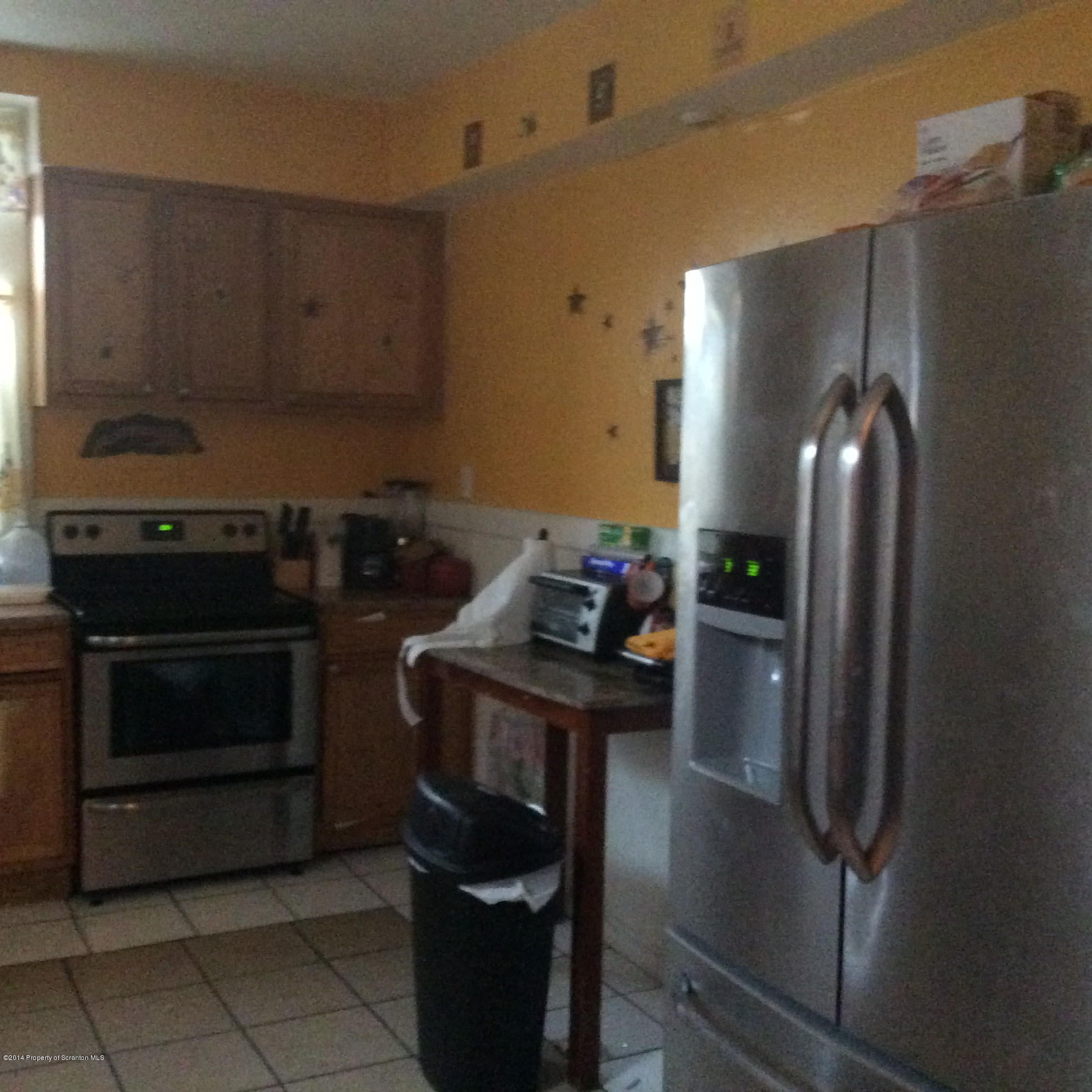 612 Green Ridge Street Scranton, PA 18509 - Photo 11 of 23 a kitchen with granite countertop a stove and a refrigerator