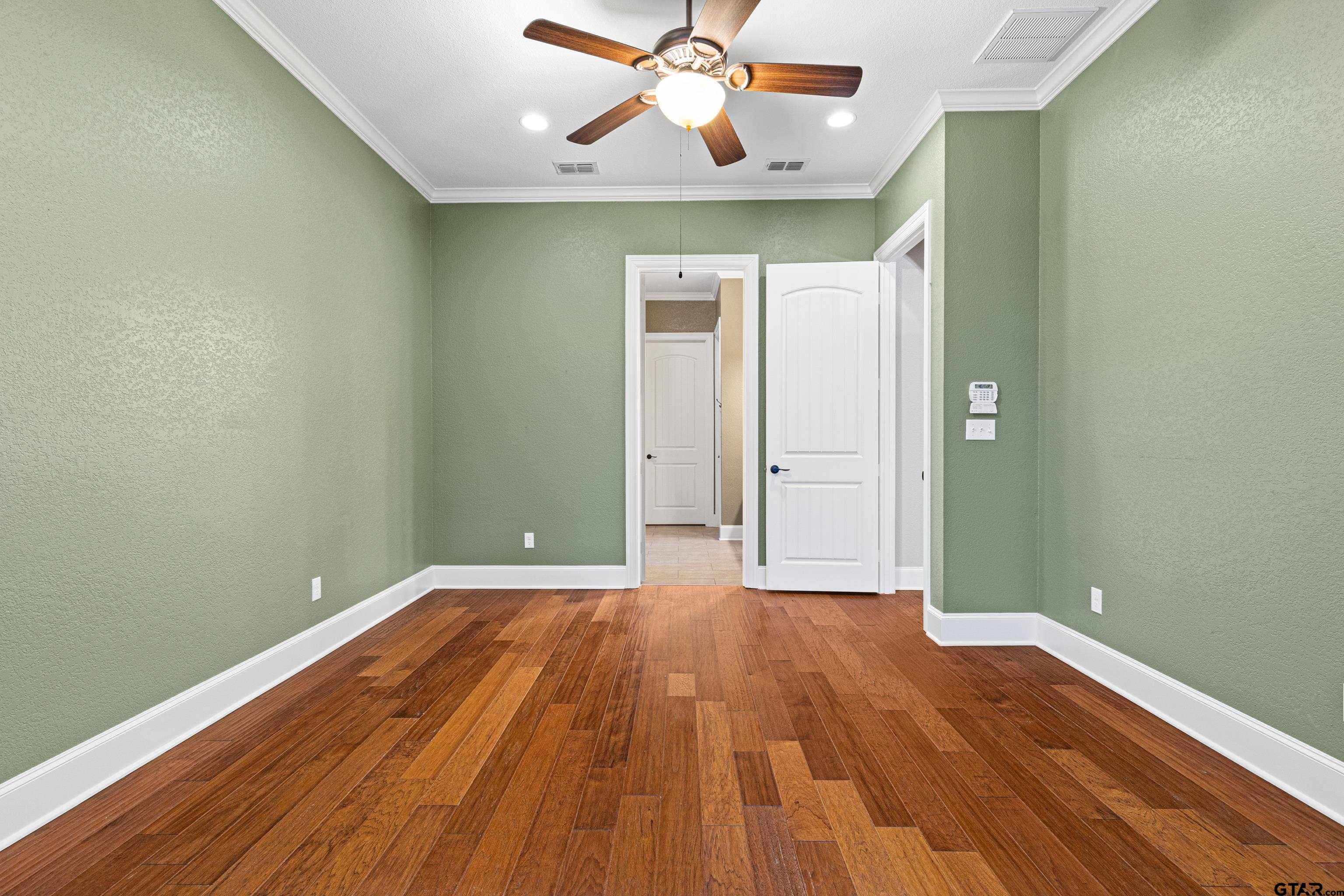 3949 Hanover Place Tyler, TX 75701 - Photo 23 of 43 wooden floor in an empty room with a window