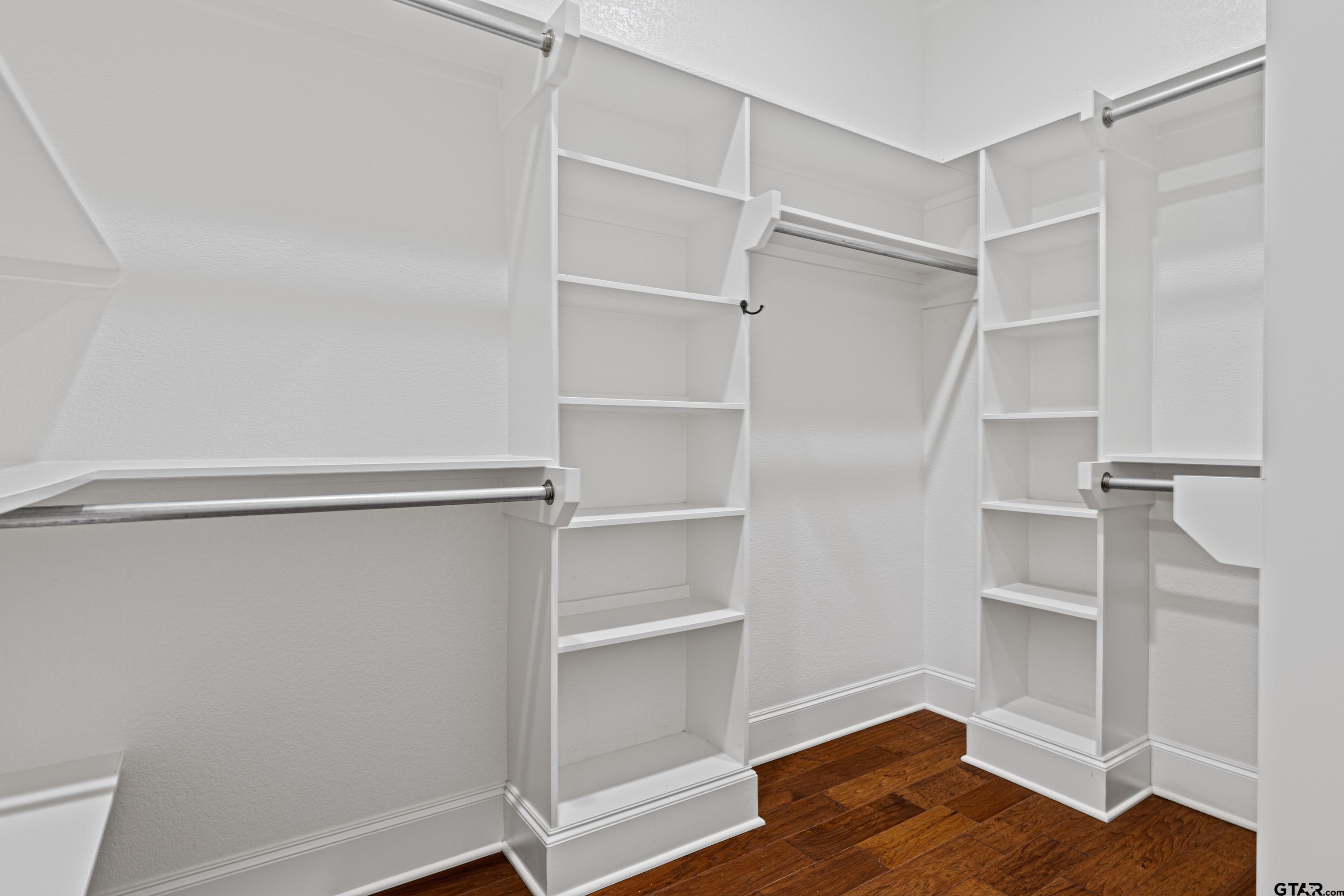 3949 Hanover Place Tyler, TX 75701 - Photo 28 of 43 a view of walk in closet with empty racks